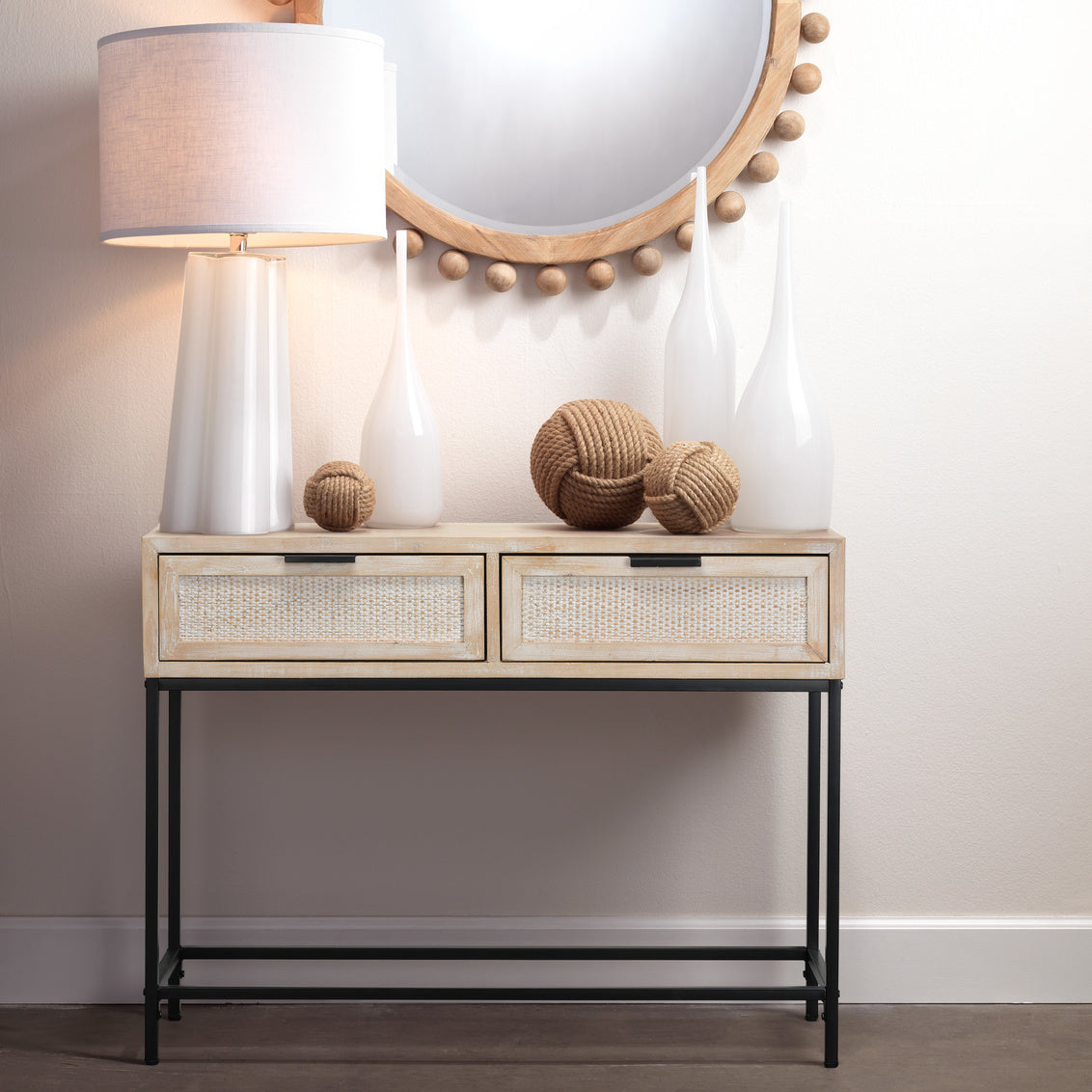 Console table with decorative items against a neutral wall