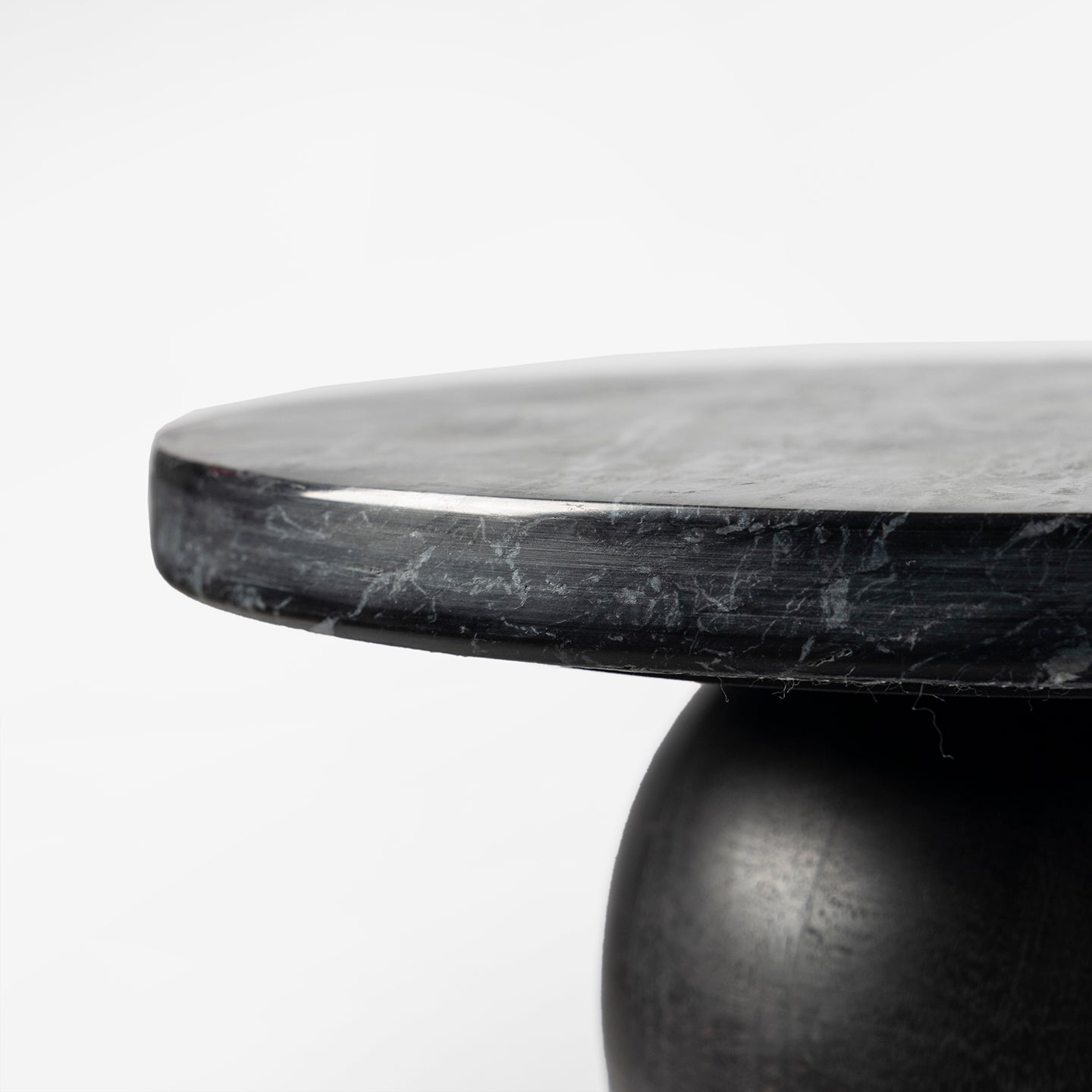 Black marble table with a minimalist design on a white background