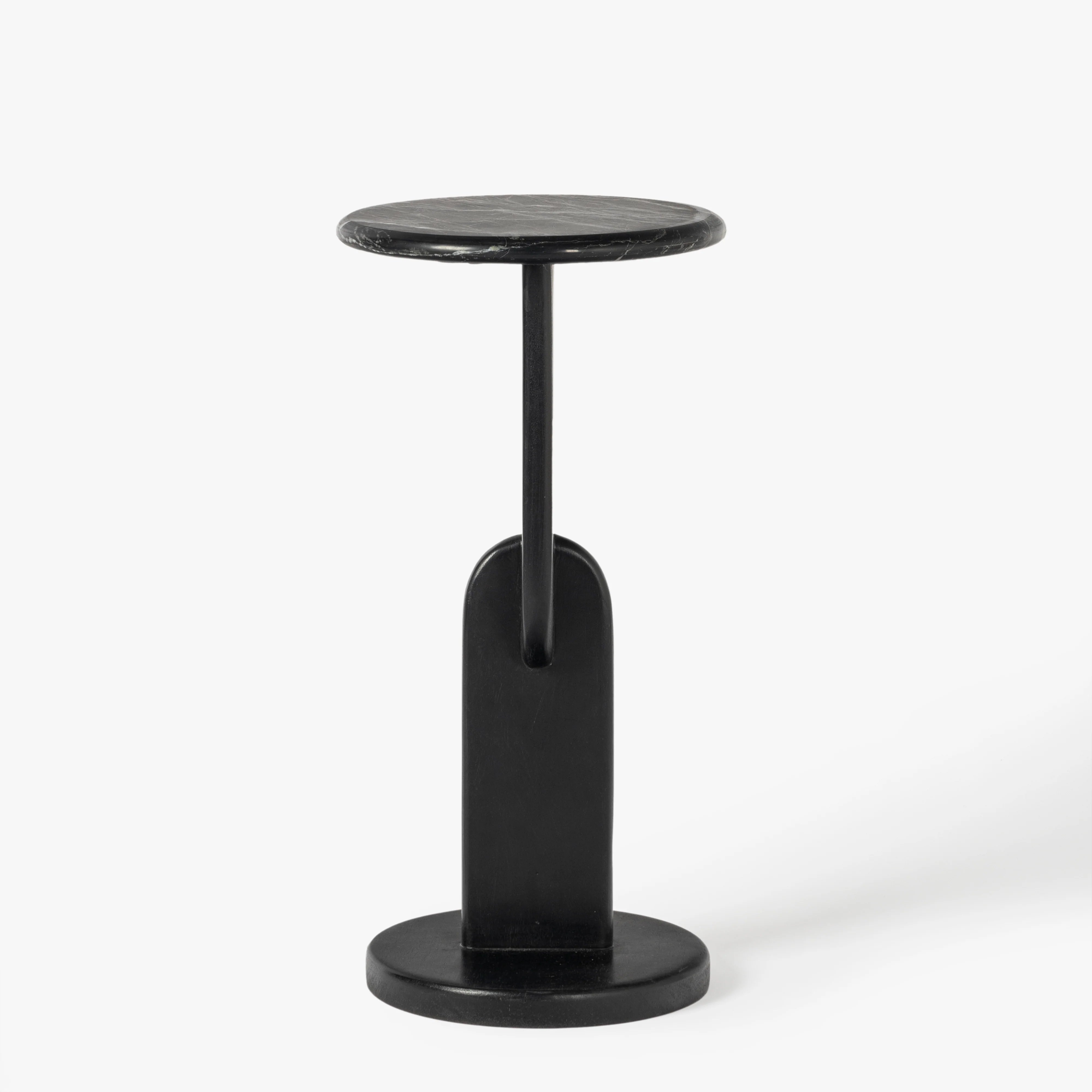 A modern black metal side table with a circular top, a single central support stem, and a round base, shown against a plain white background.
