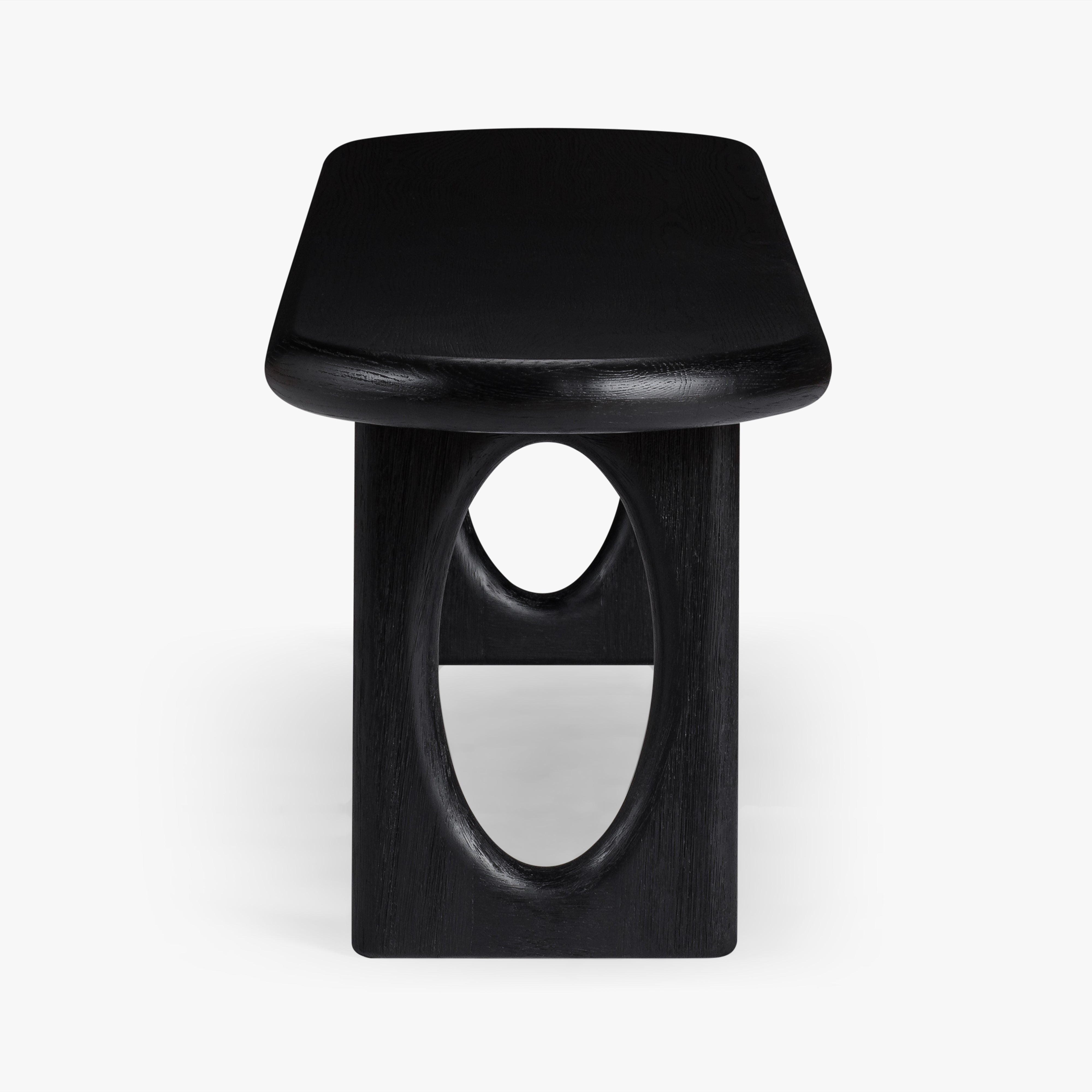 Black wooden bench with a unique design on a white background