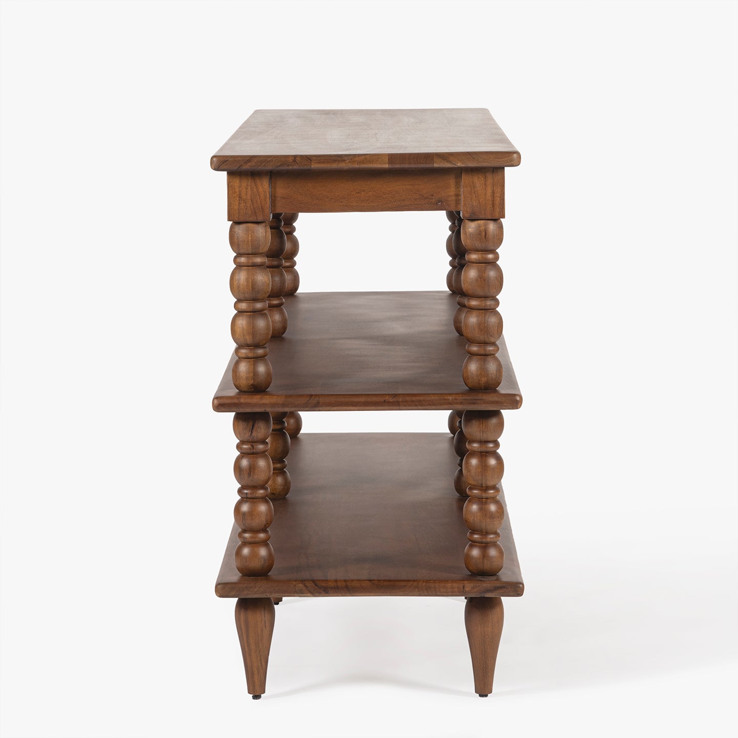 Wooden side table with three shelves on a white background