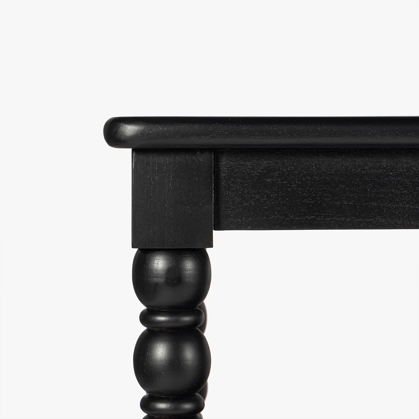 Close-up of a black wooden console table