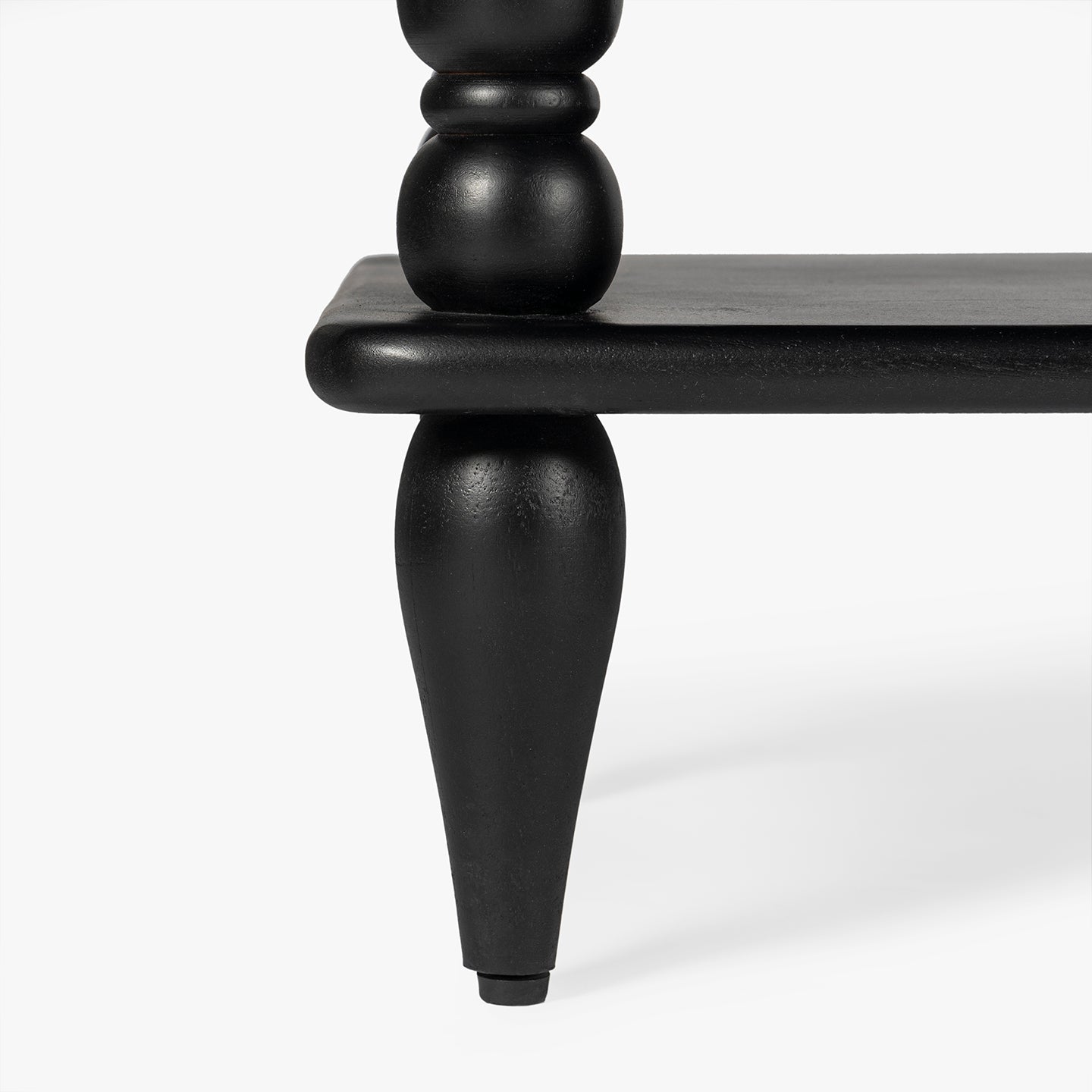 Black wooden bookcase with spindle leg