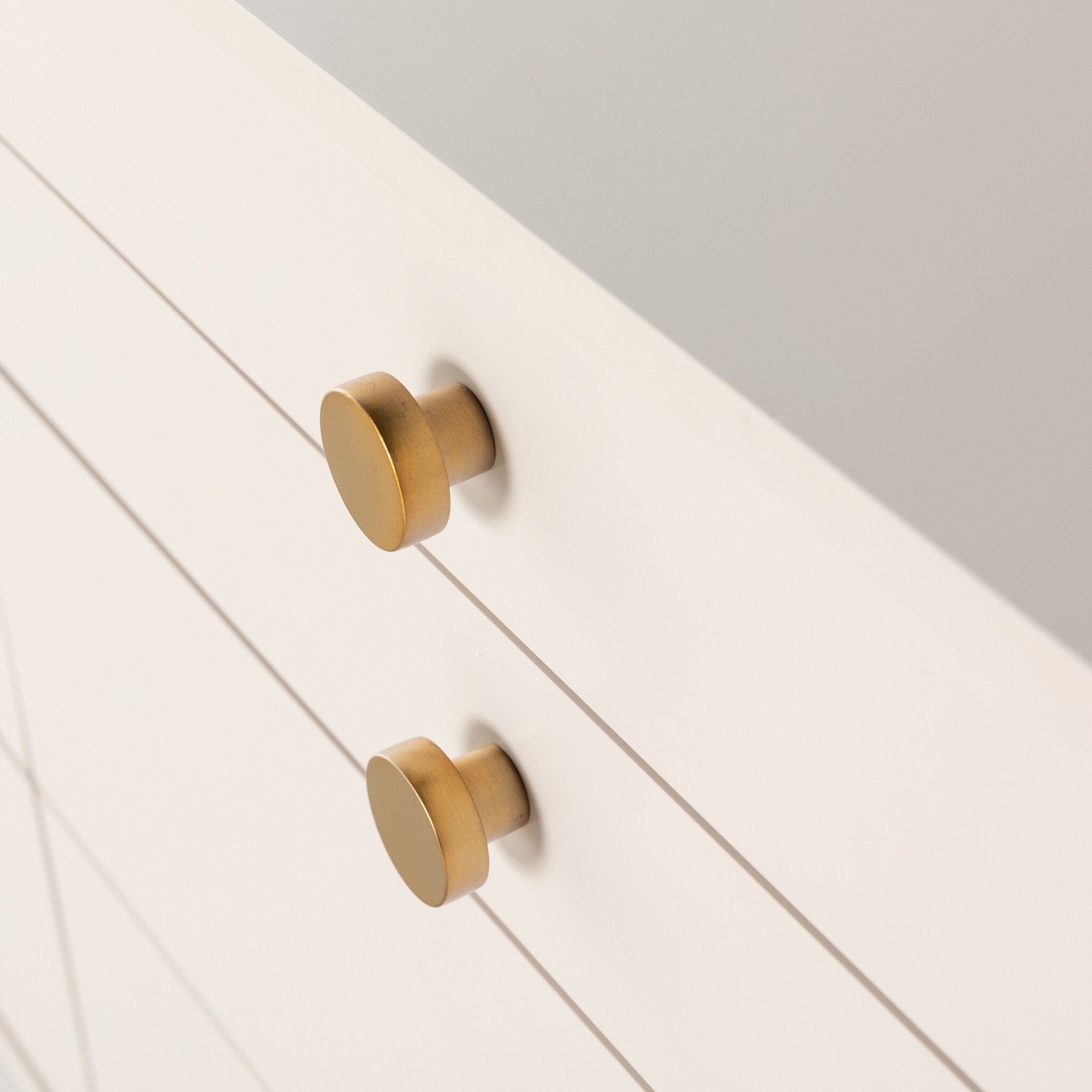 Contemporary off-white dresser with velvet-lined compartments and modern hardware