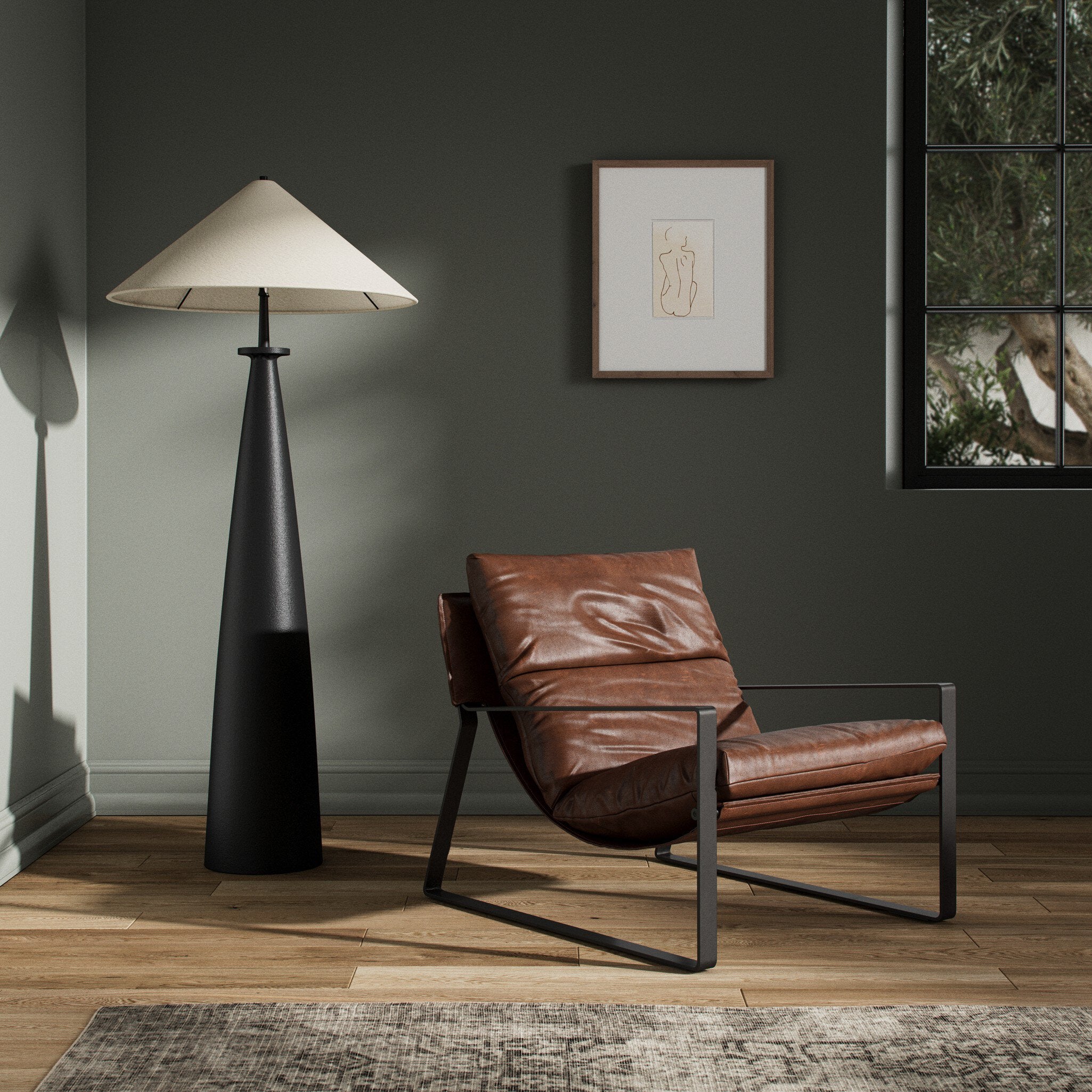 Modern interior with a brown leather chair and black floor lamp against a gray wall.