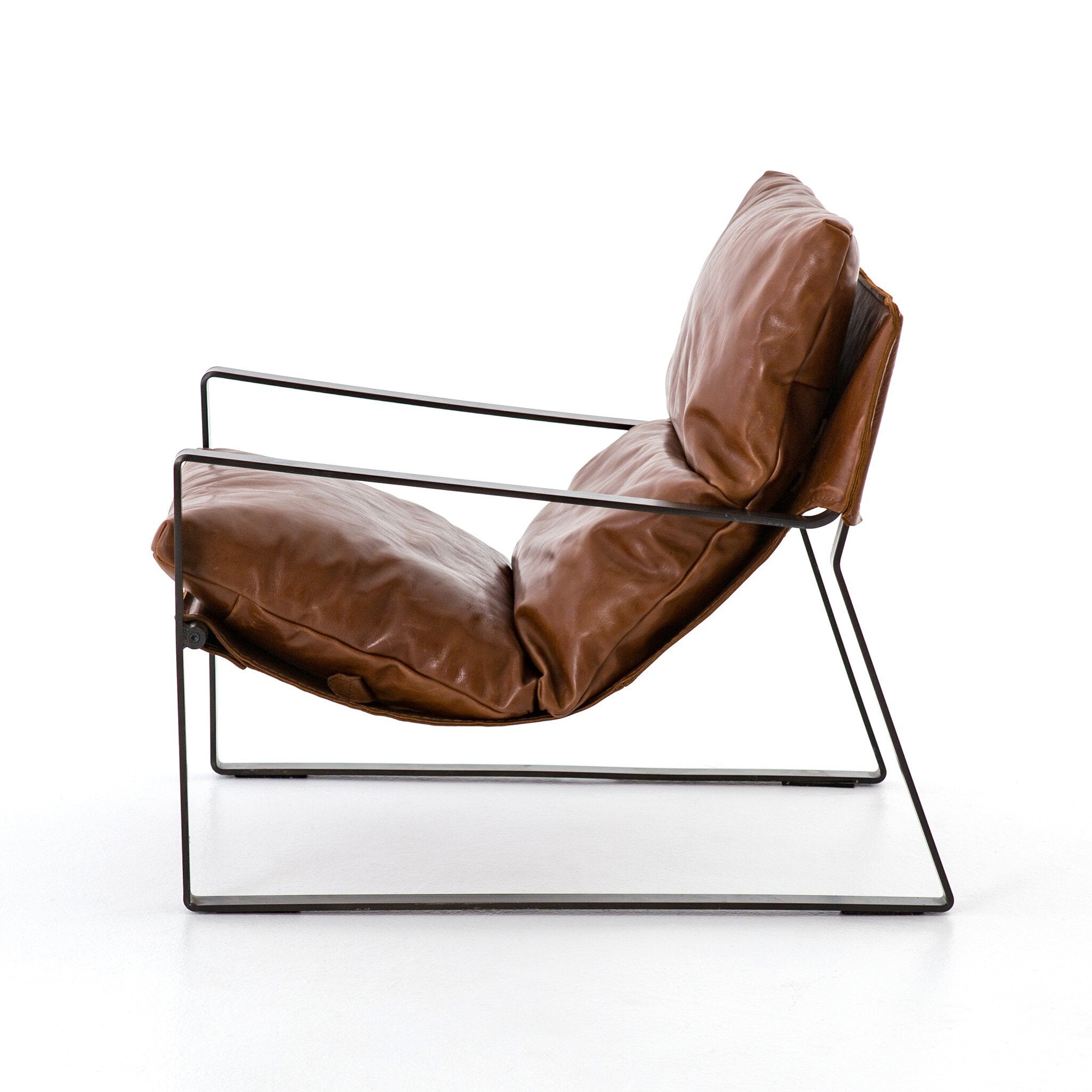 Brown leather chair with a metal frame on a white background