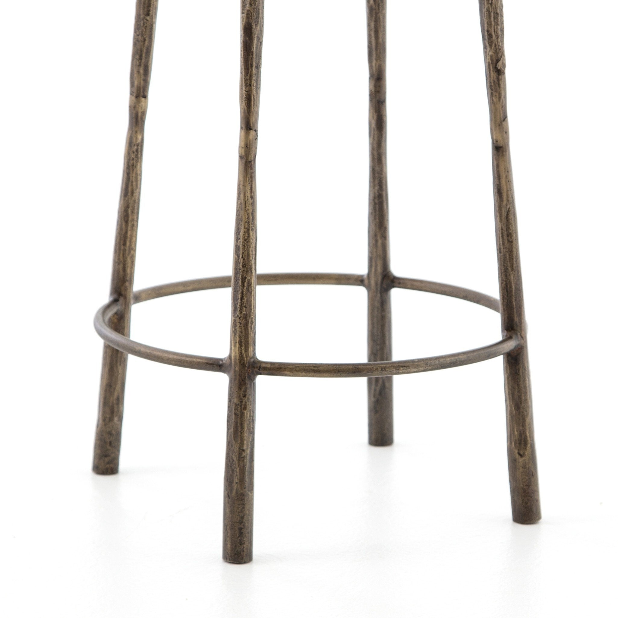 Brass counter stool legs made of hammered iron on a white background