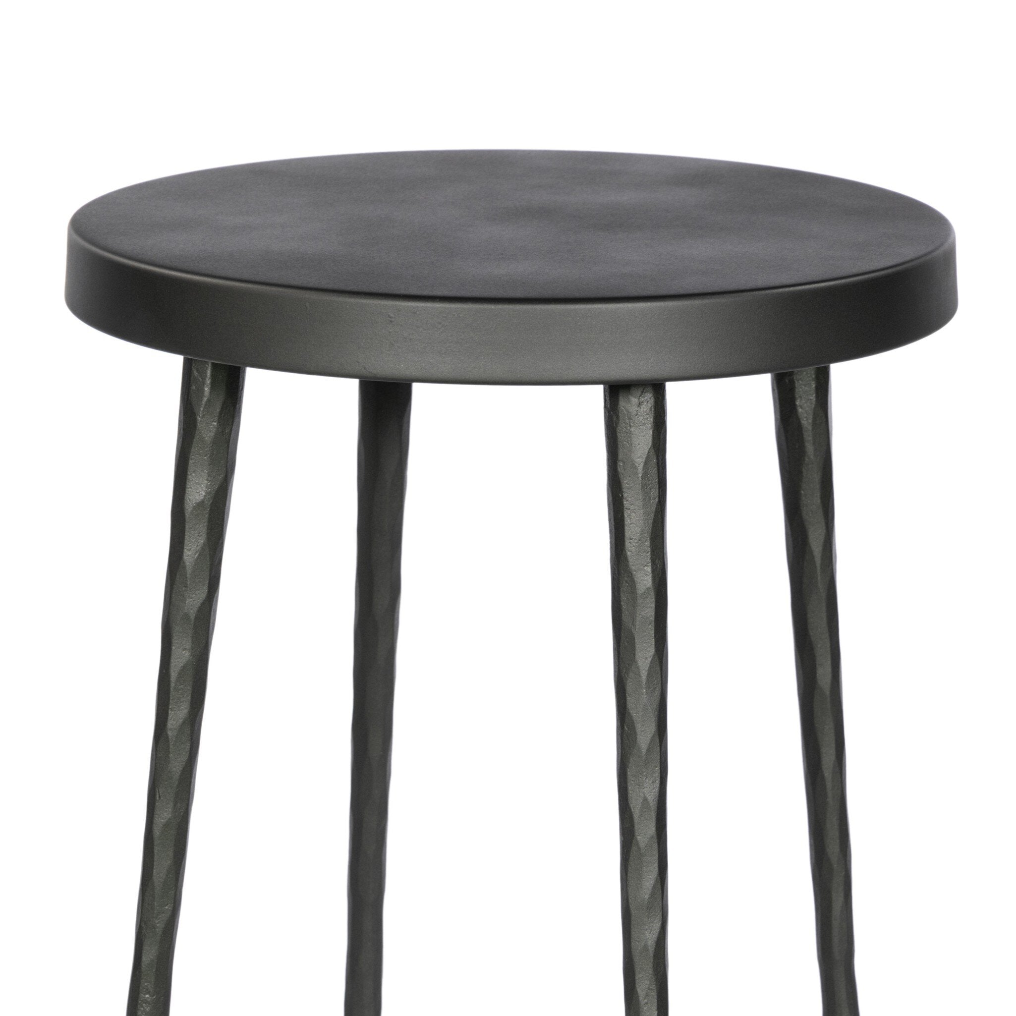 Black hammered iron round stool with four legs on a white background
