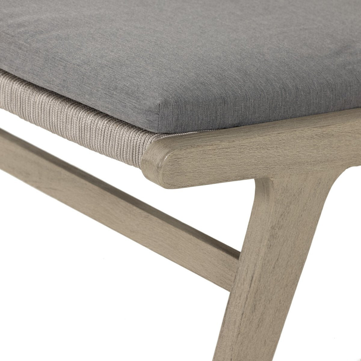 Close-up of a chair with a gray cushion and wooden frame on a white background