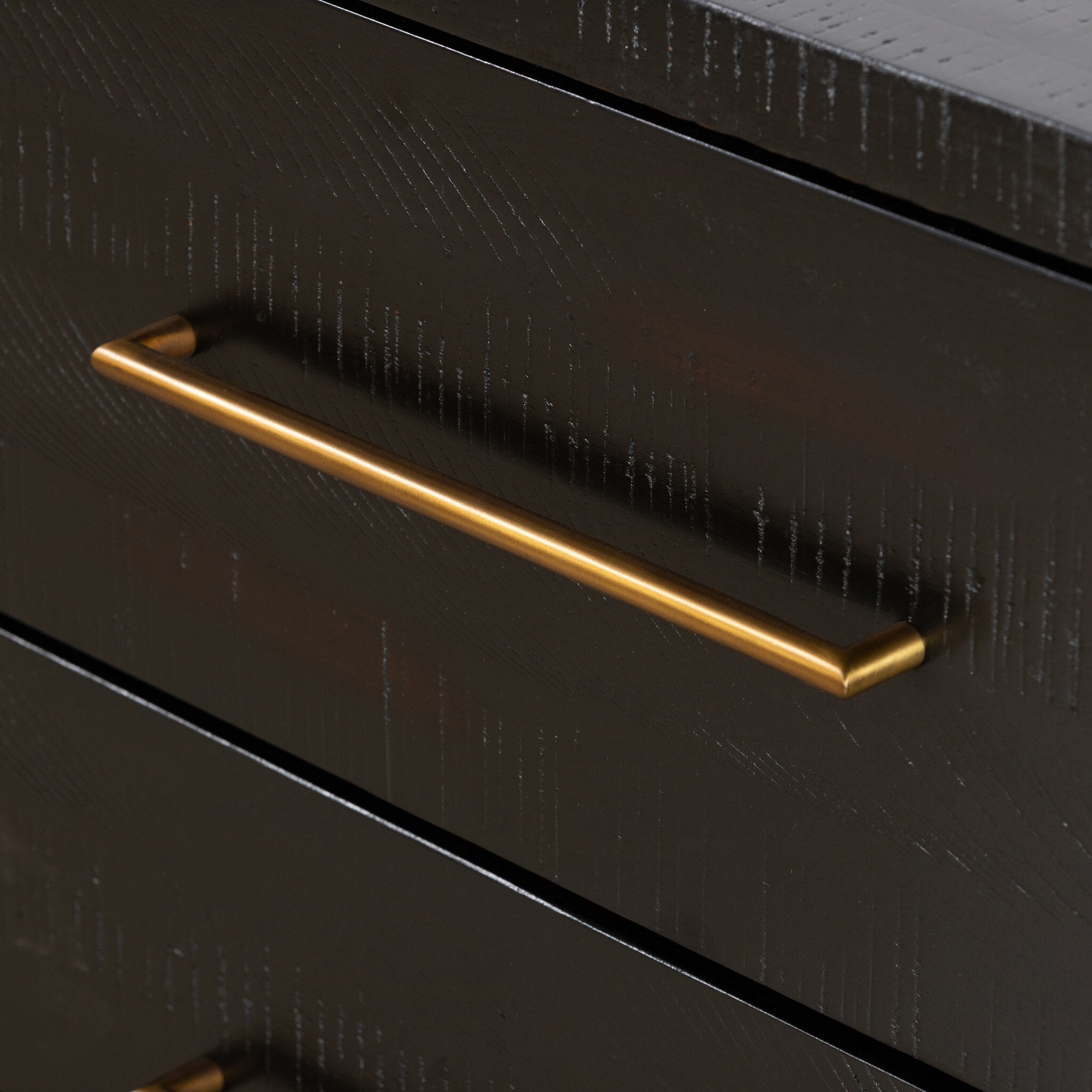Black drawer with a gold handle