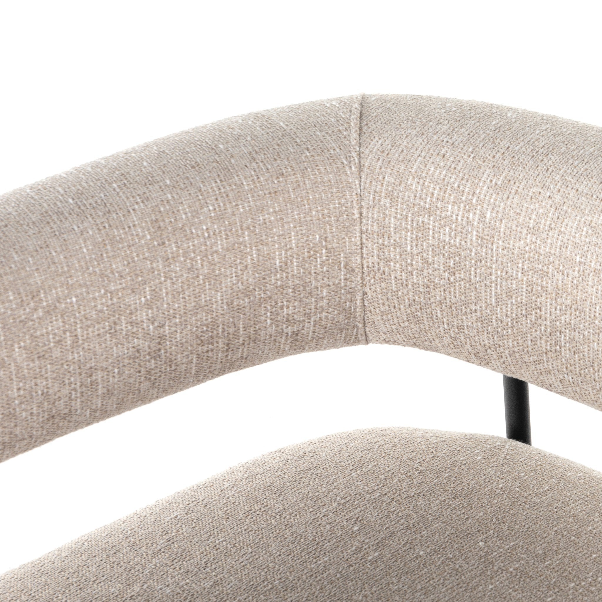 Close-up of a beige upholstered chair with a white background