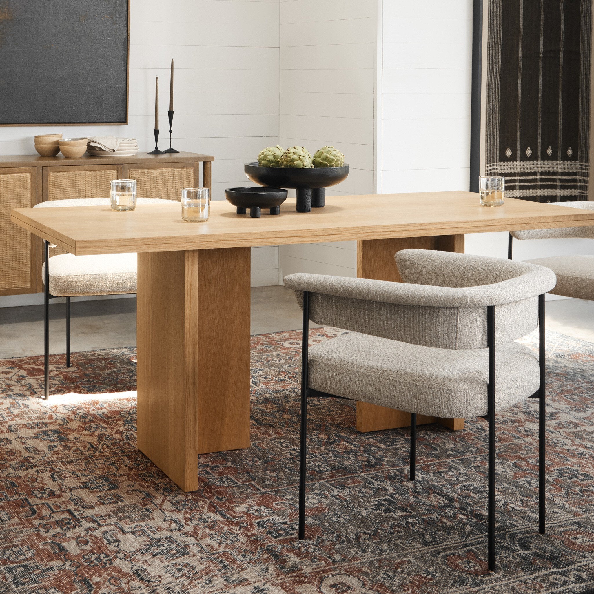 Dining table with chairs in a modern room setting