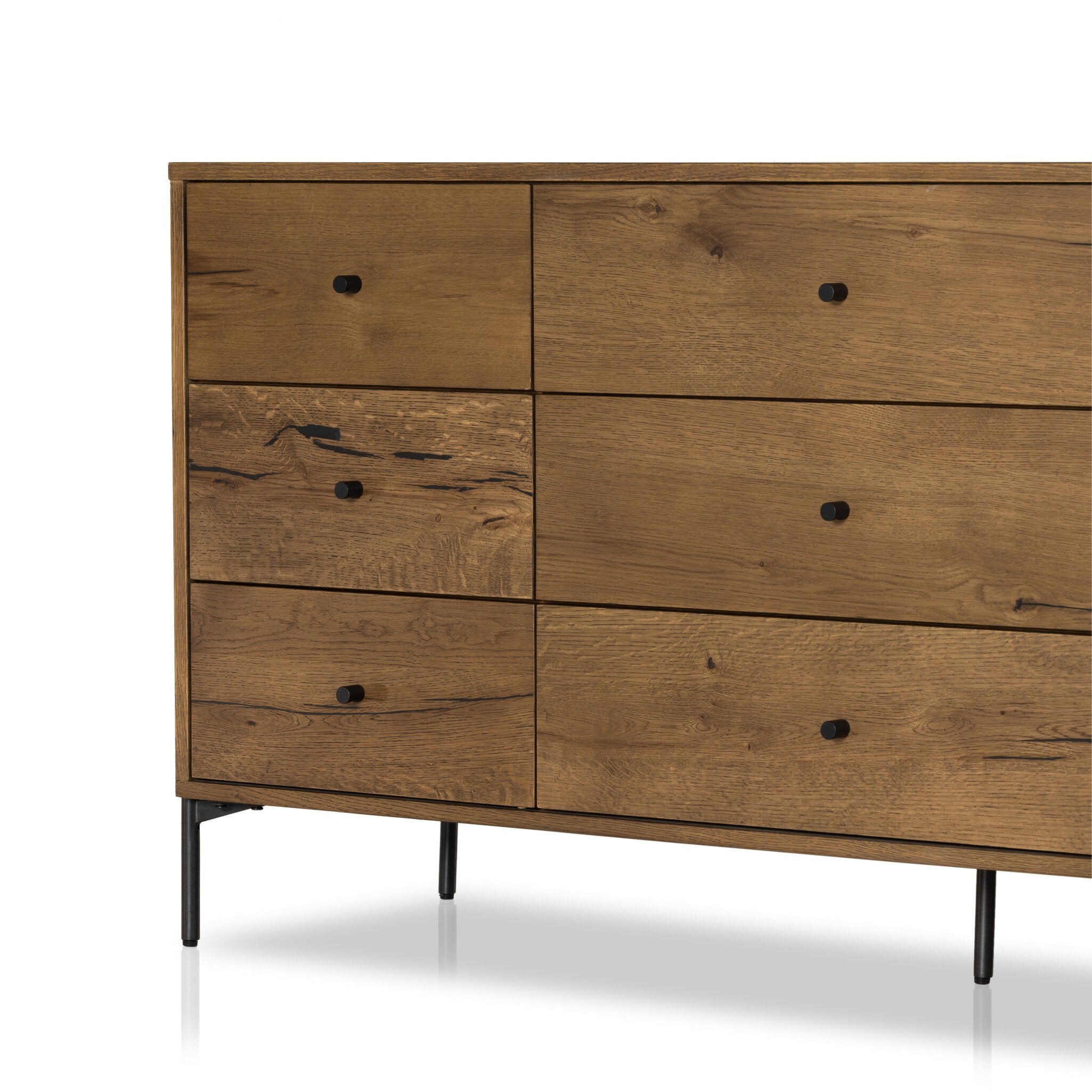 Wooden dresser with multiple drawers on a white background