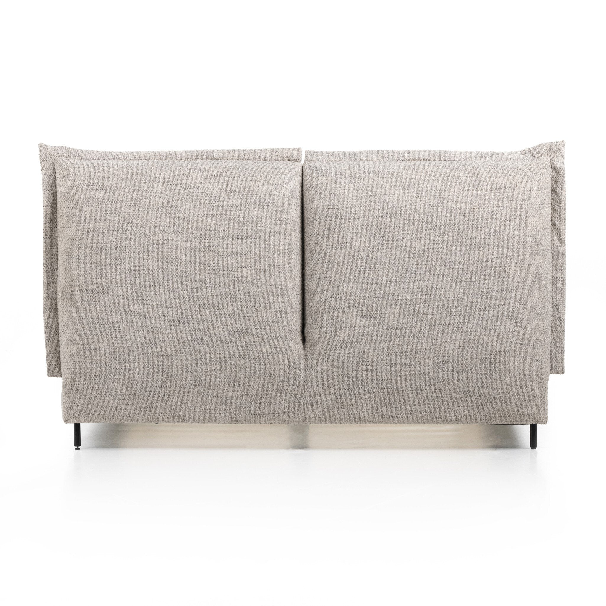 Back view of upholstered grey headboard of a bedframe