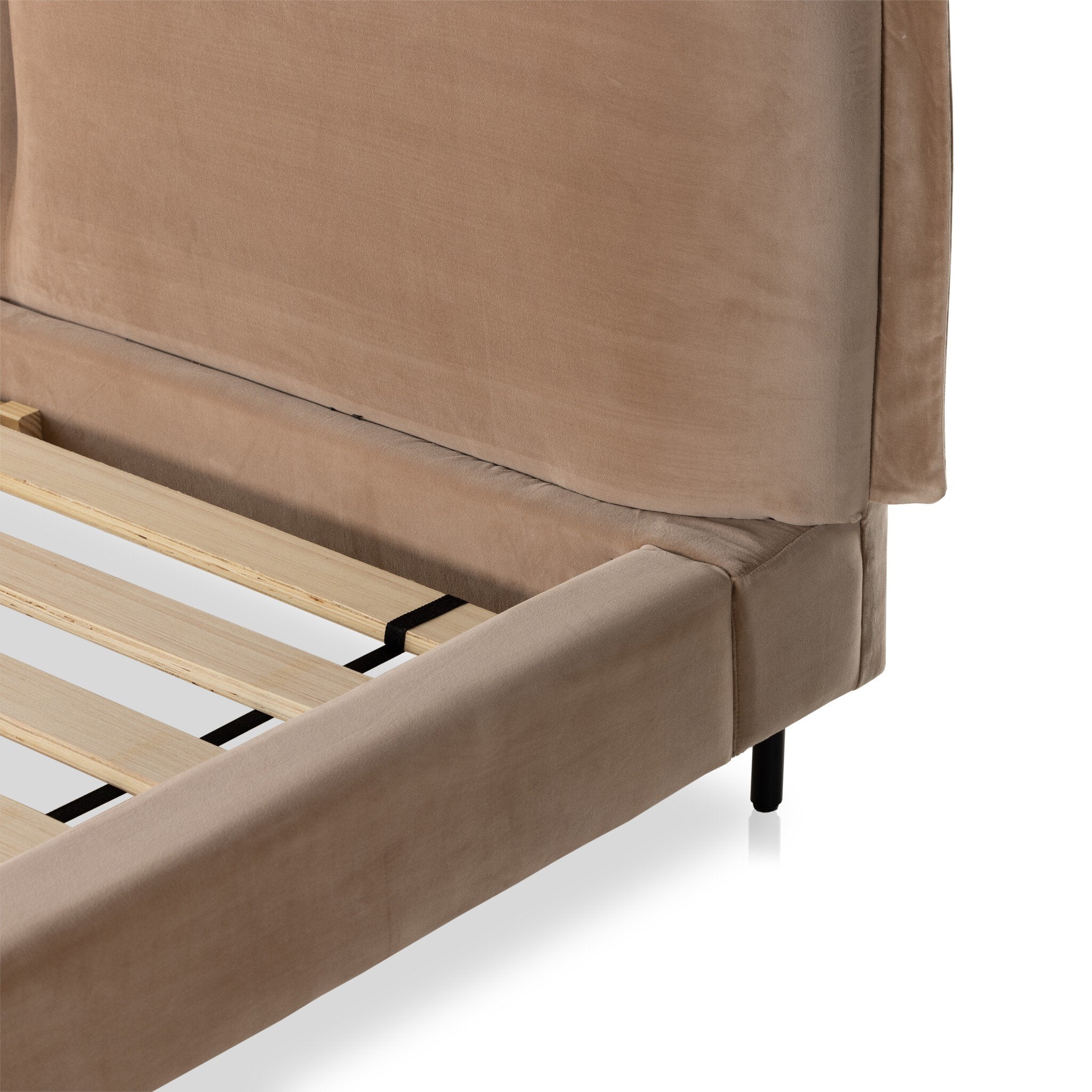 Brown upholstered velvet bed frame with wooden slats on a white background