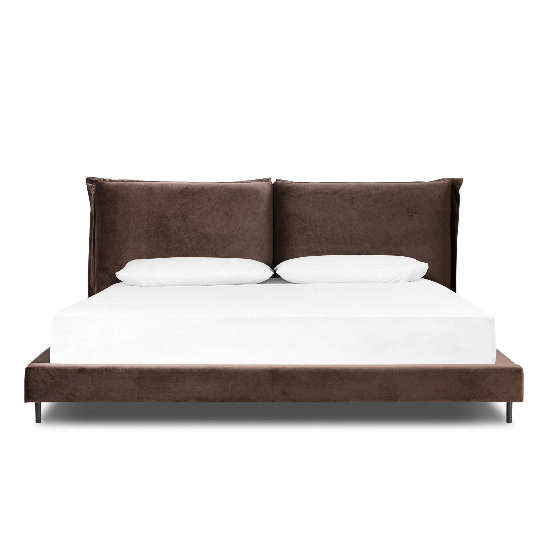 Brown upholstered bed with white bedding on a white background