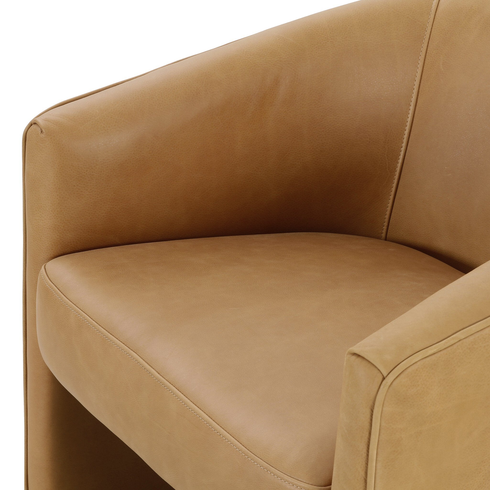 Close-up of a brown leather armchair on a white background