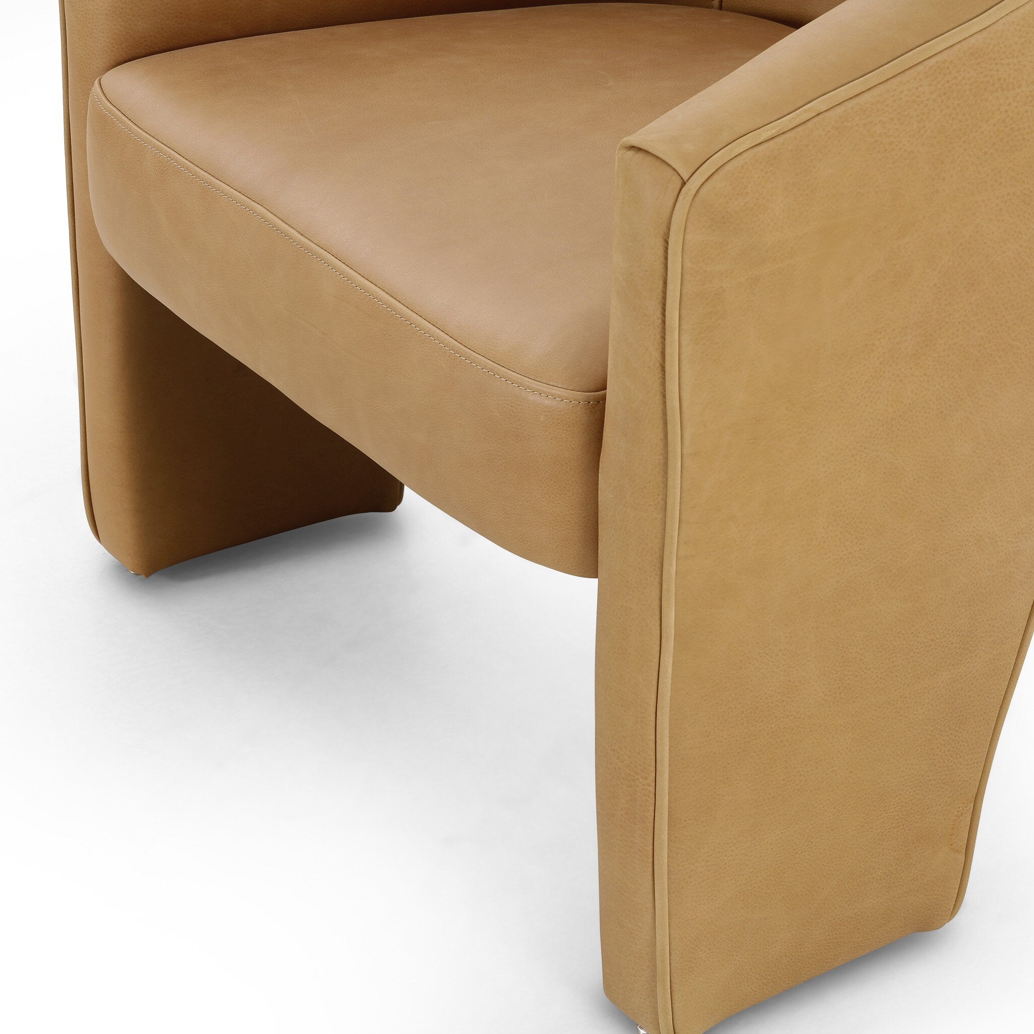 Close-up of a brown leather chair on a white background