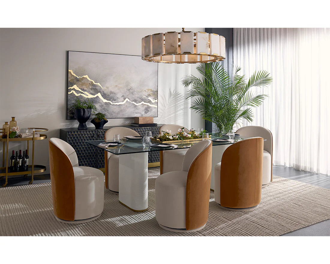 Modern dining room with a glass table and stylish chairs.