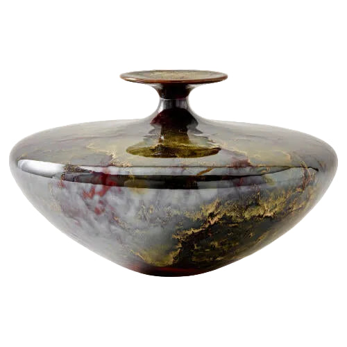 Marble-patterned ceramic jar on a white background