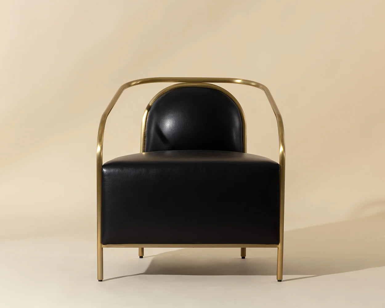 Black chair with gold frame on a beige background