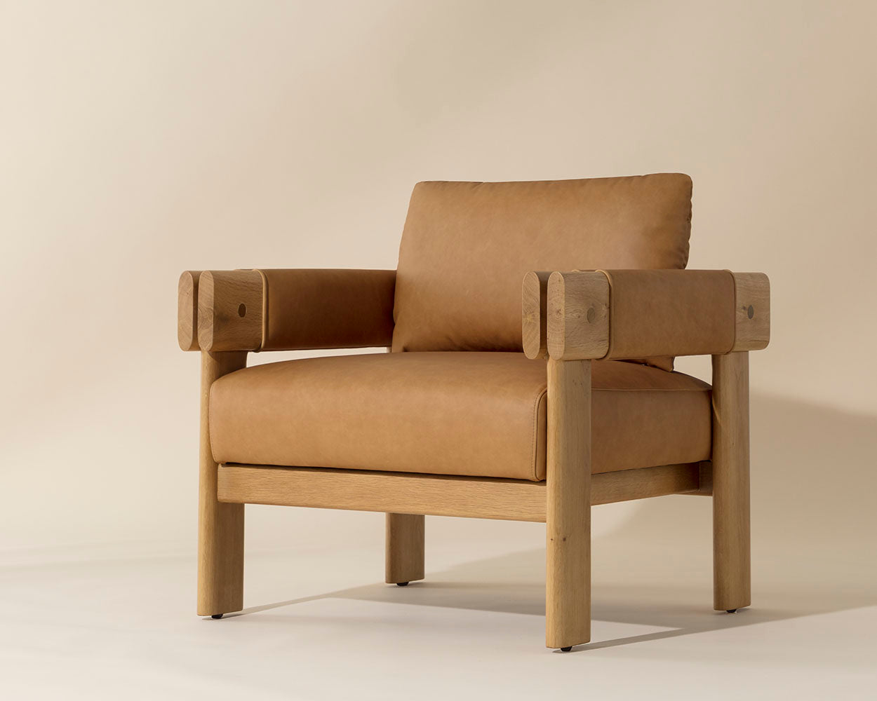 Brown leather armchair on a beige background