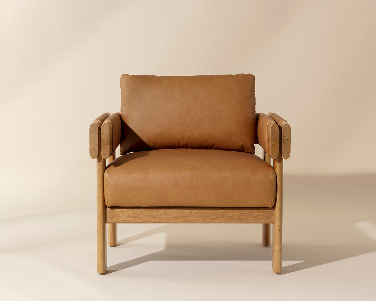Brown armchair on a beige background