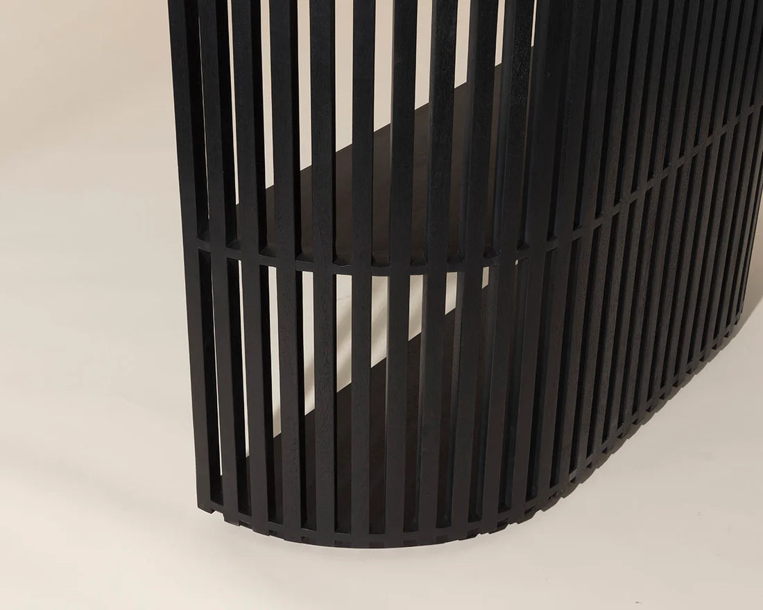 Black metal basket on a beige background