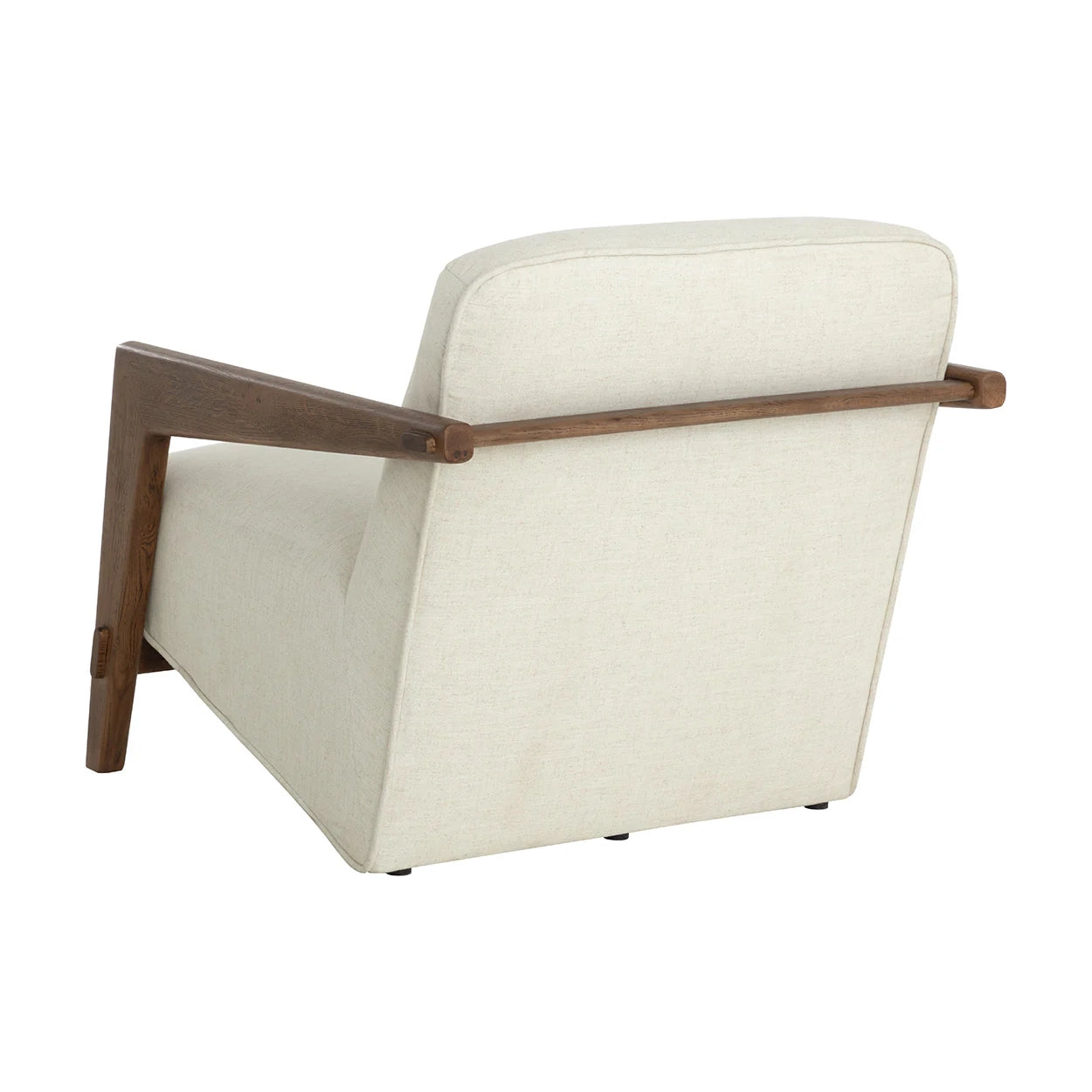 A modern upholstered armchair with cream fabric and a dark brown wooden frame and armrests, shown from a three-quarters angle on a white background.