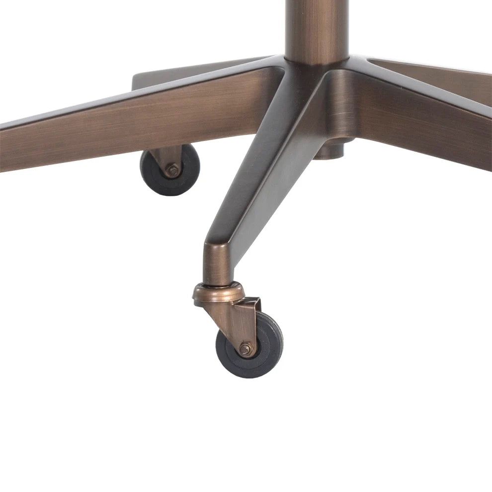 Close-up of an office chair base with a five-star metal frame in a warm bronze finish and black caster wheels, shown on a plain white background.
