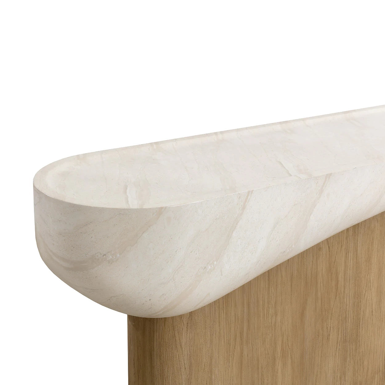 Close-up of a carved stone bowl or tray with a smooth curved rim, shown resting on a light wood base against a plain white background.