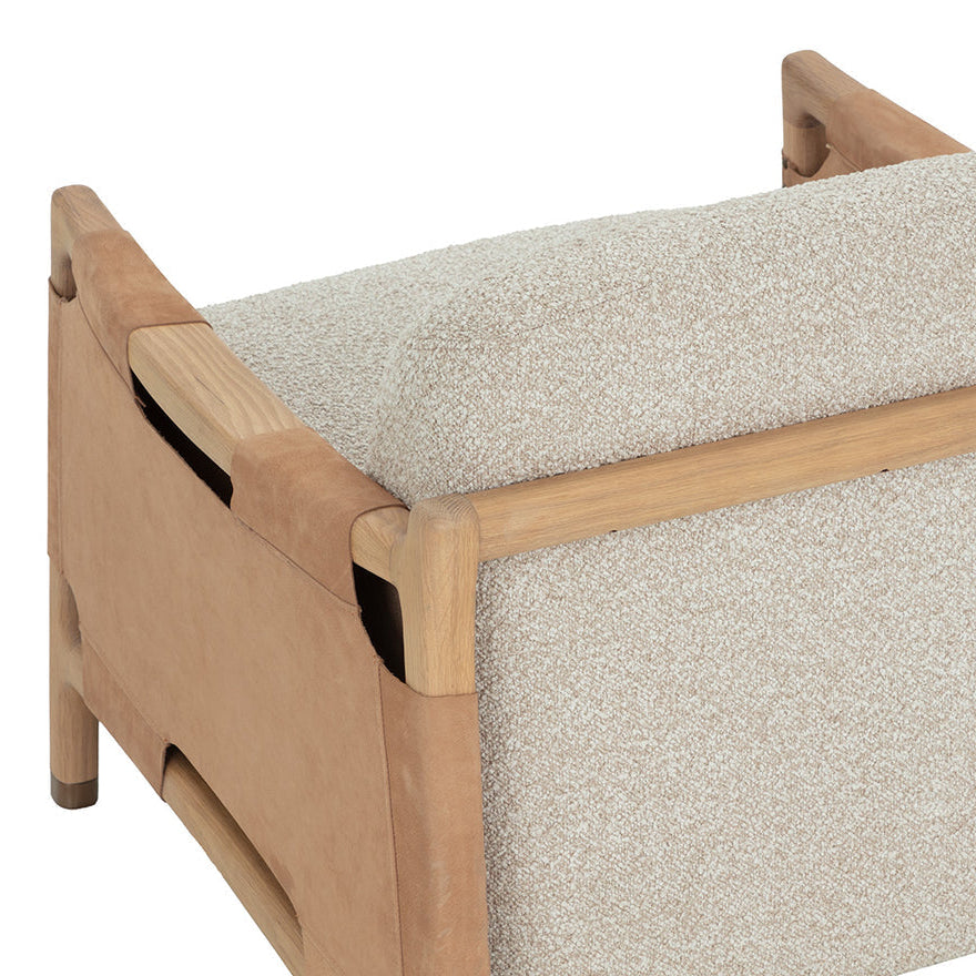 Wooden bench with a textured beige cushion on a white background
