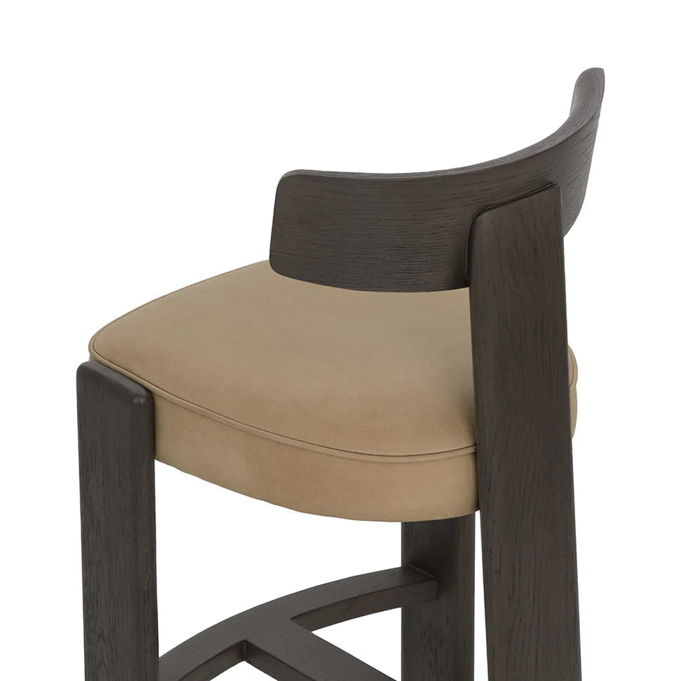 Bar stool with brown cushioned seat and backrest on a white background