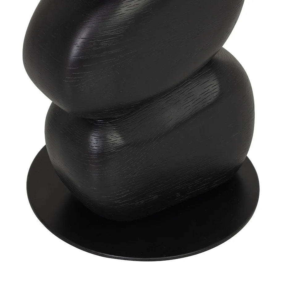 Black spiral decorative table base on a white background