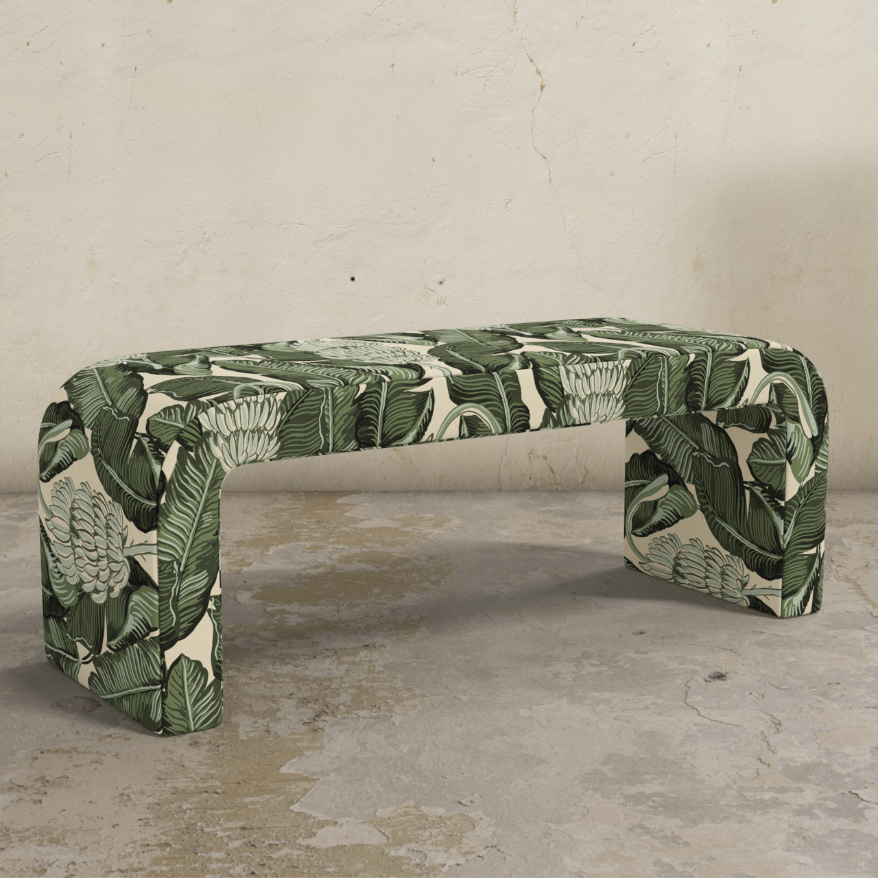 Green and white patterned bench on a concrete floor with a gray wall background