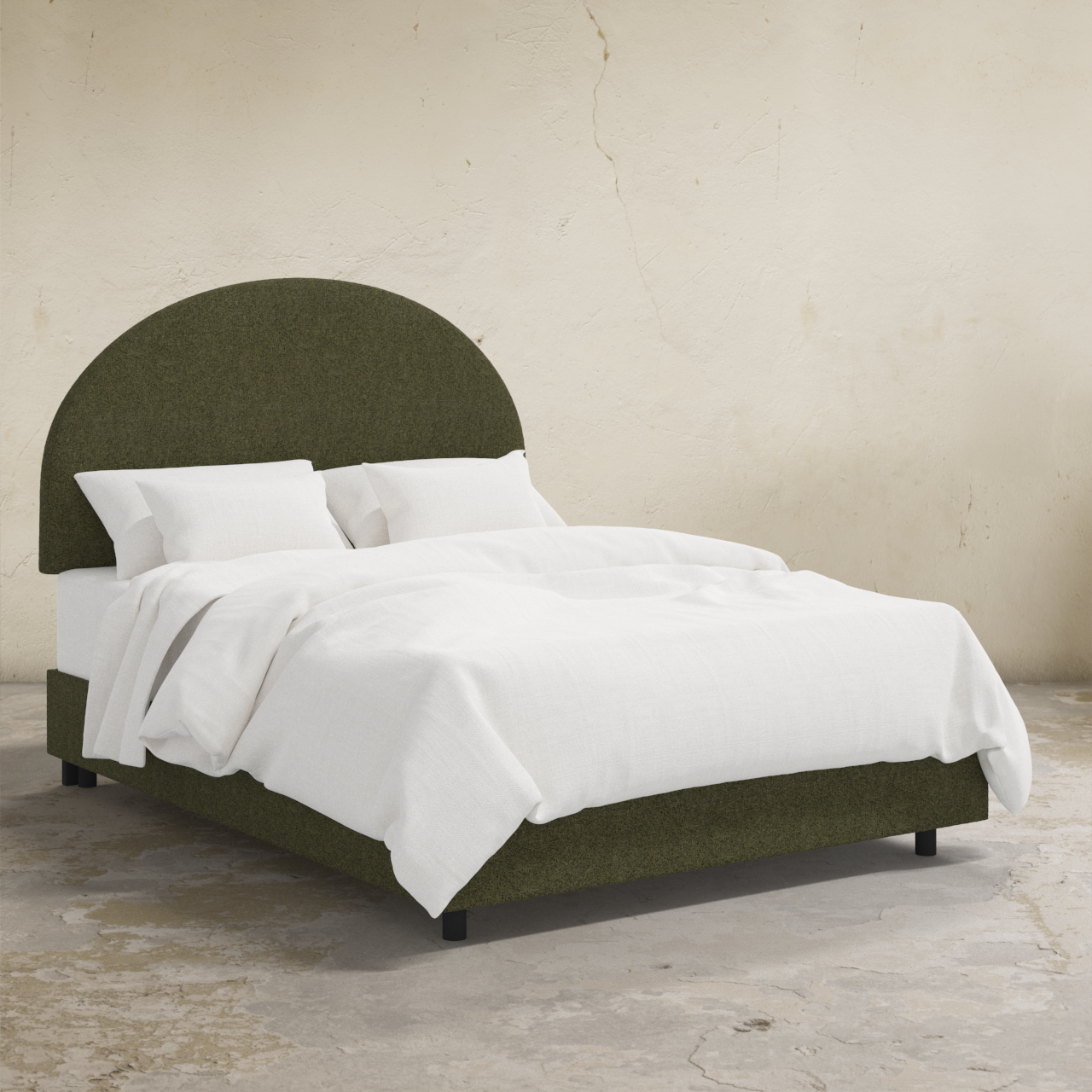 Green upholstered bed with white bedding against a beige wall.