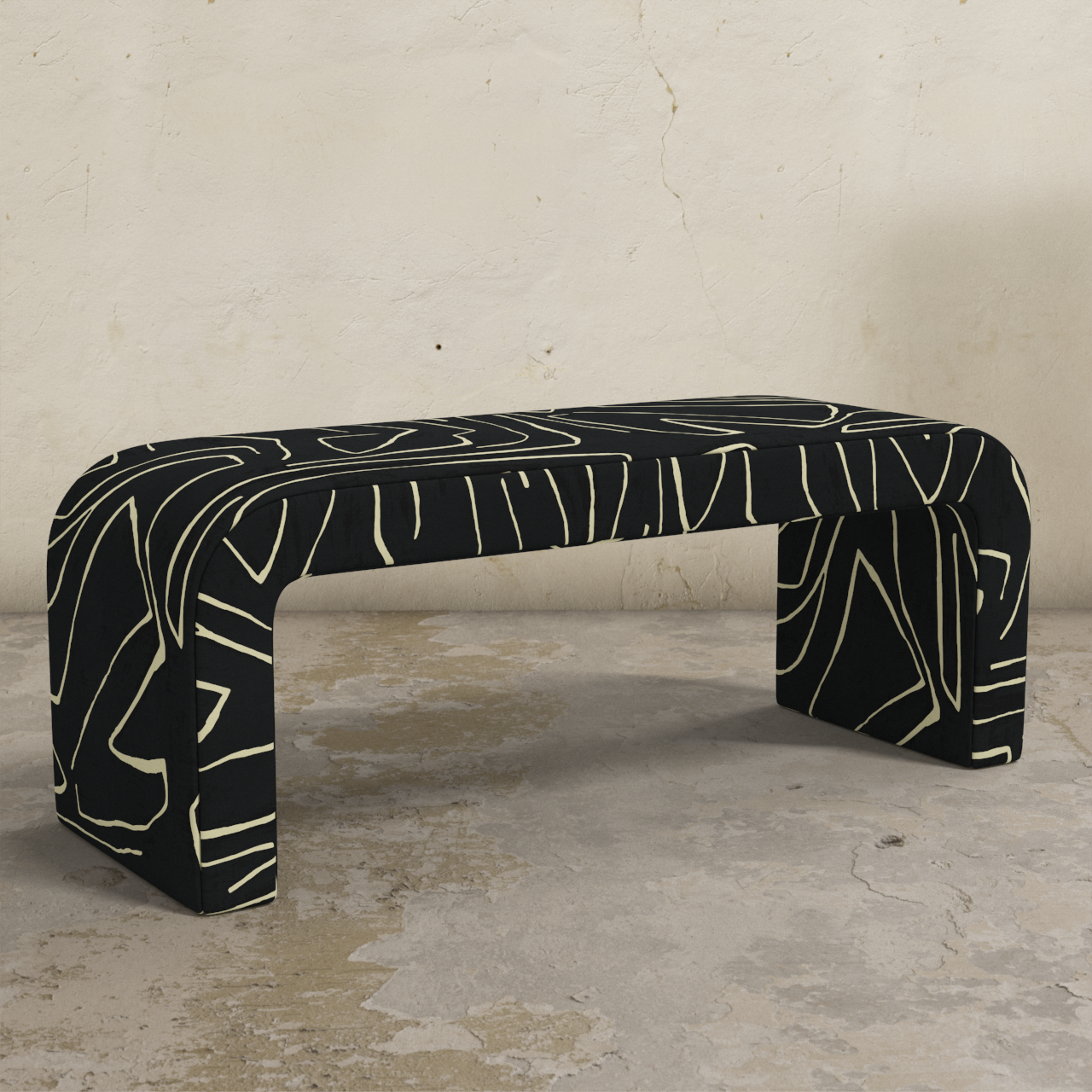 Black and white patterned bench against a textured wall.