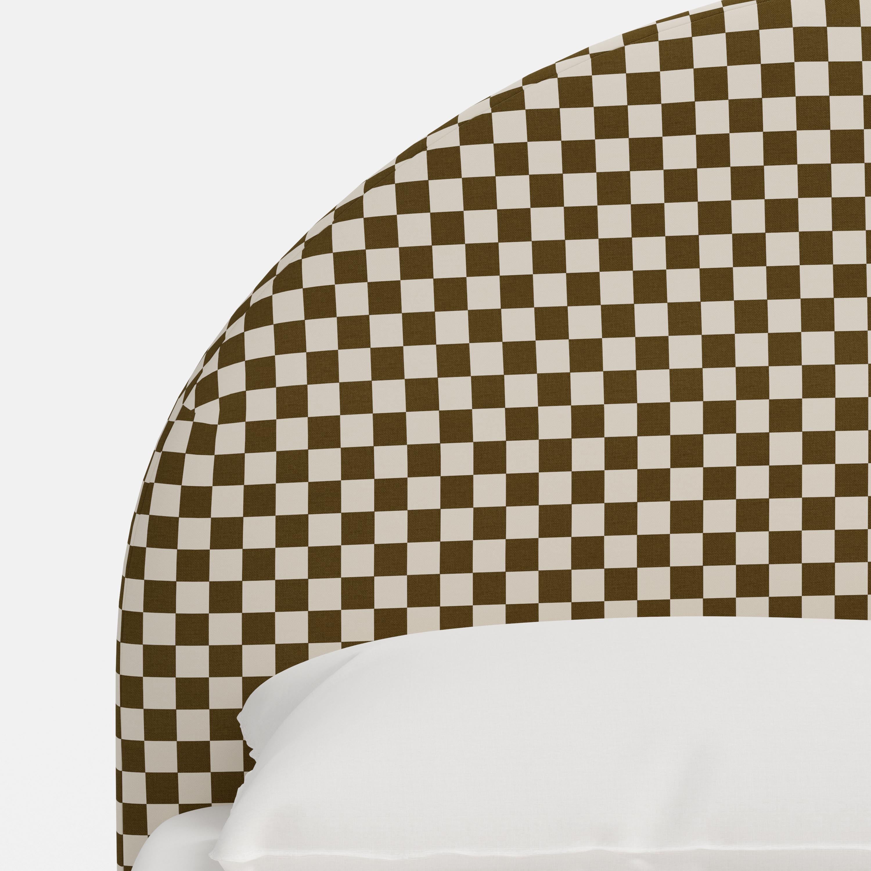 Bed with checkered headboard and footboard on a white background