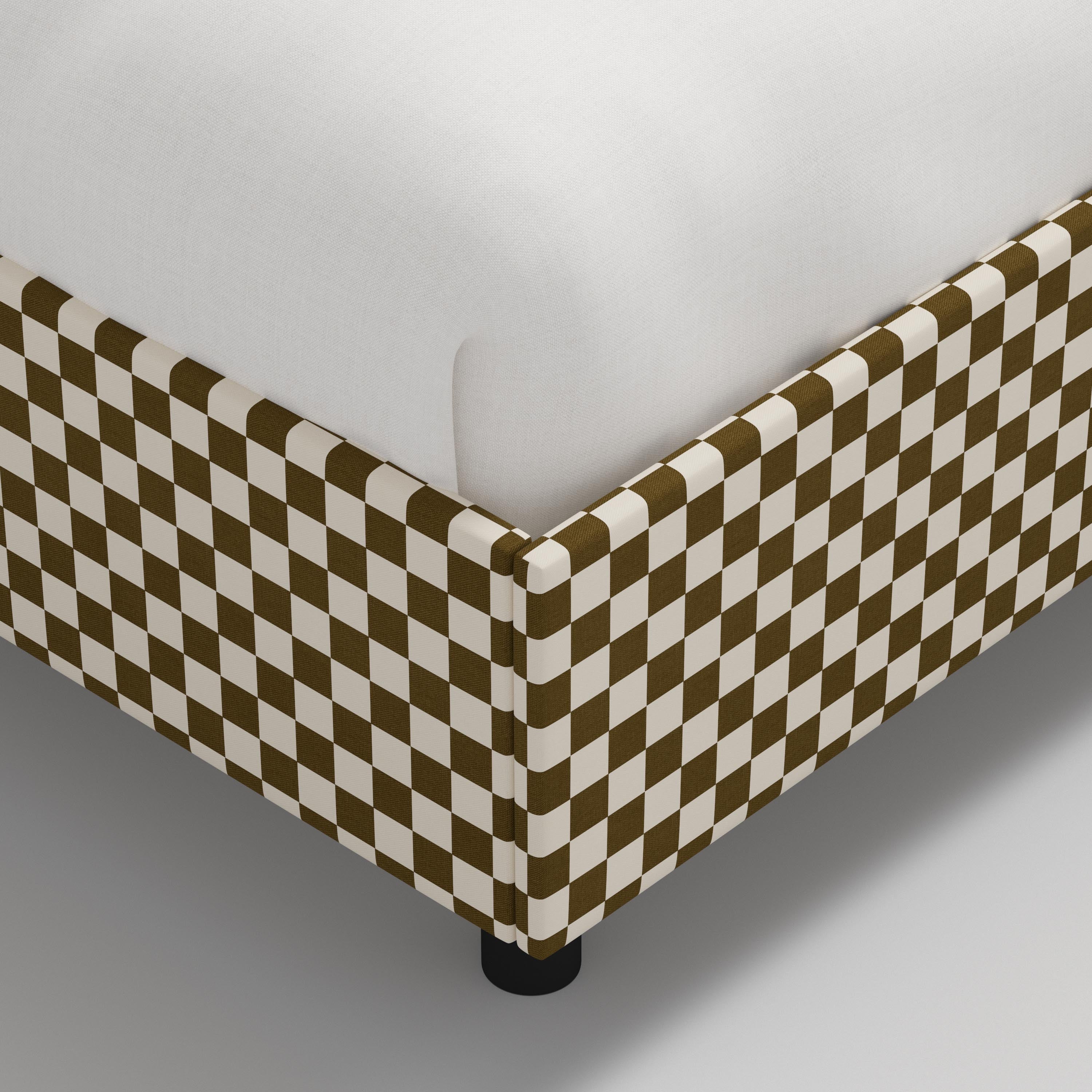 Bed with checkered headboard and footboard on a white background
