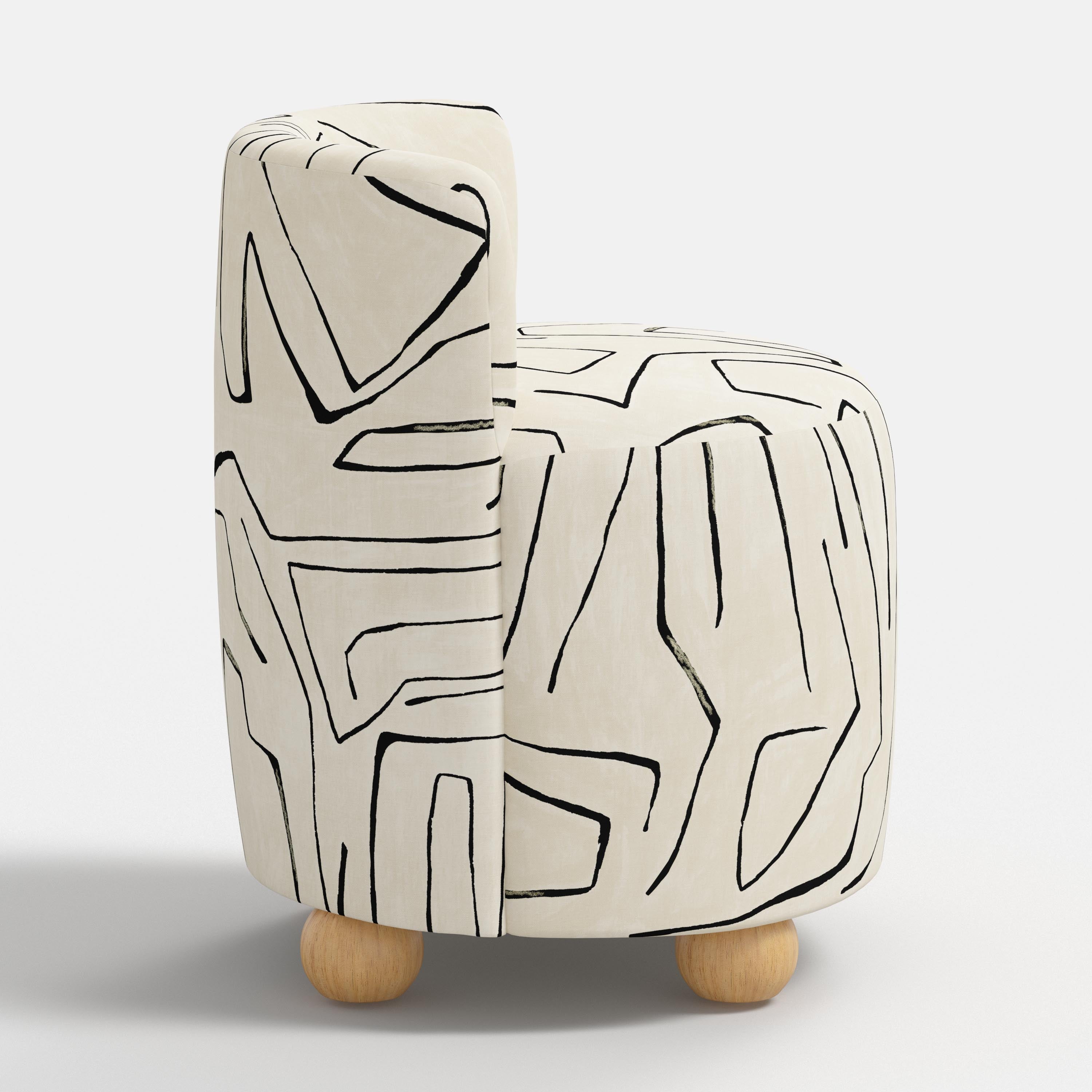 White chair with abstract black line design on a white background