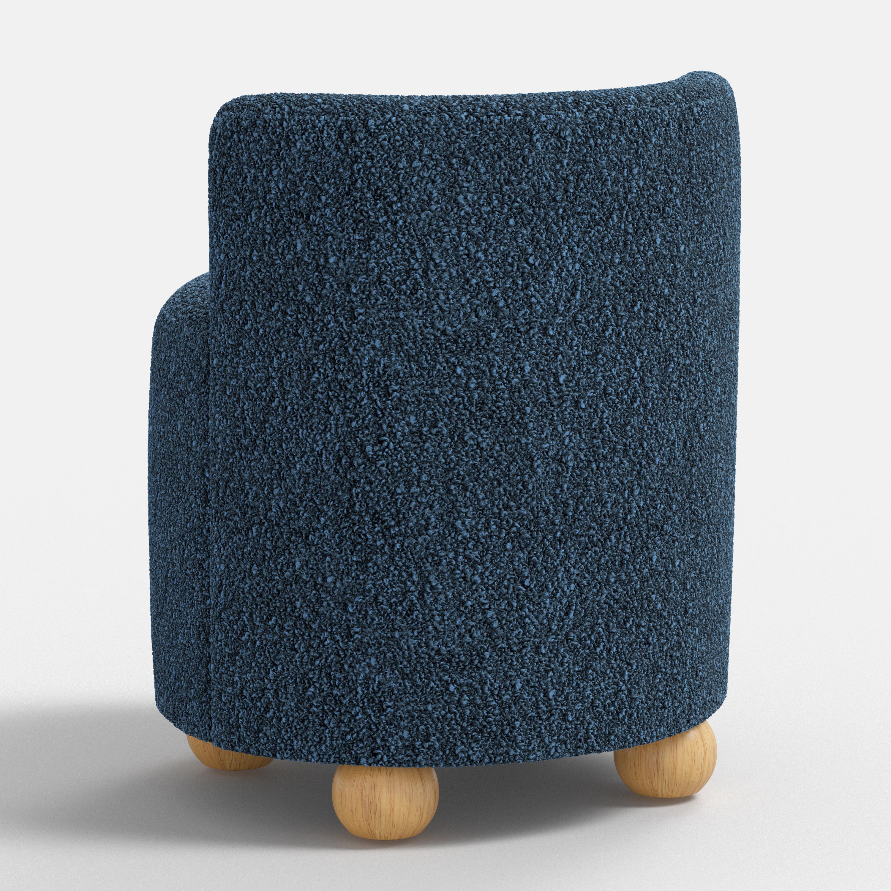Blue textured armchair with wooden legs on a white background