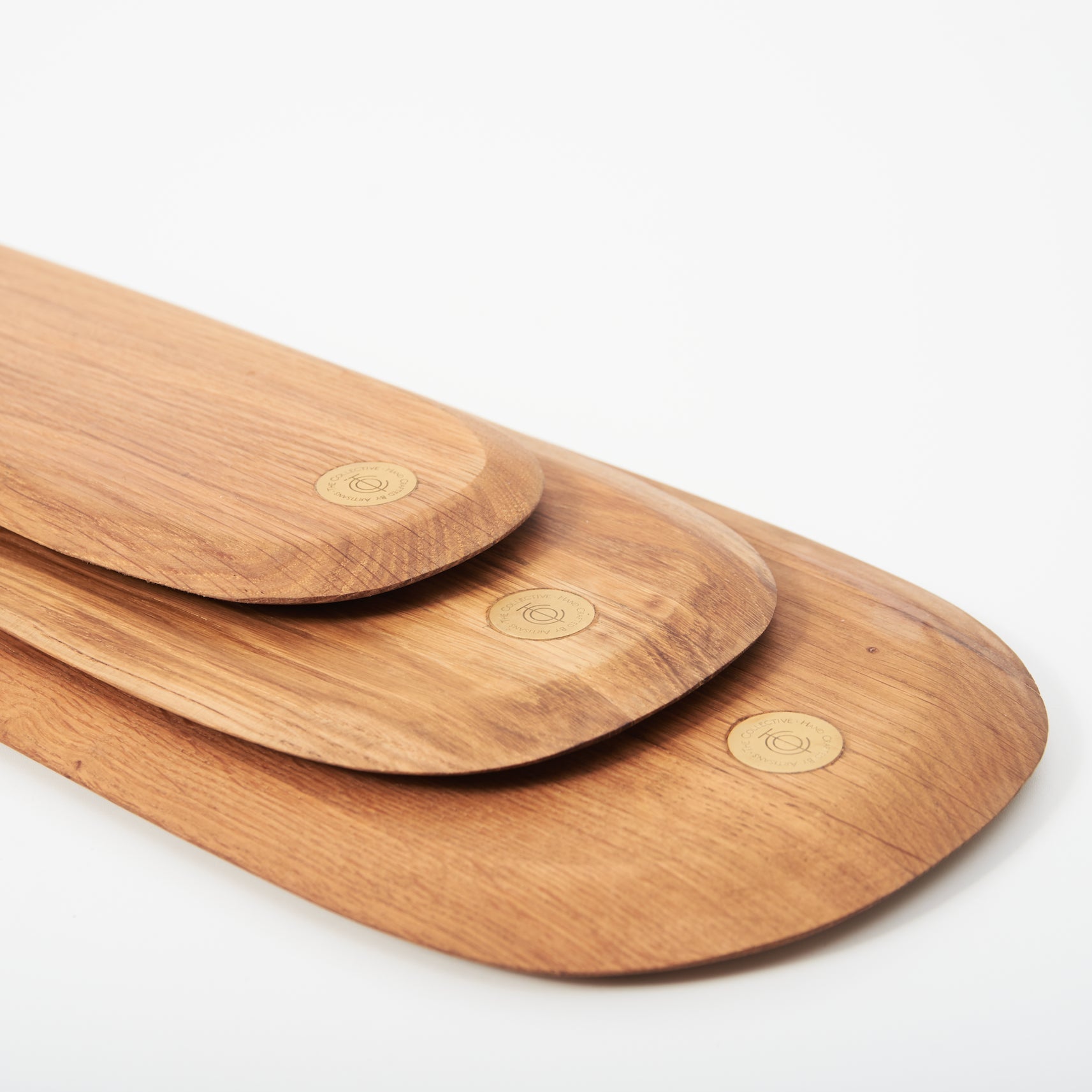 Three wooden serving boards on a white background