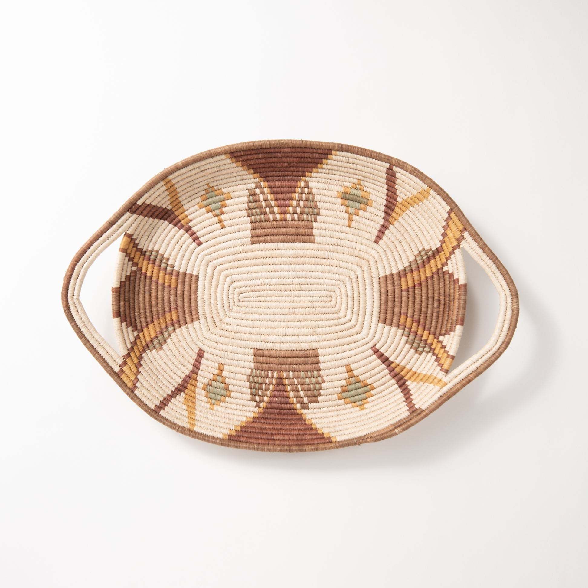 Woven basket with geometric pattern on a white background