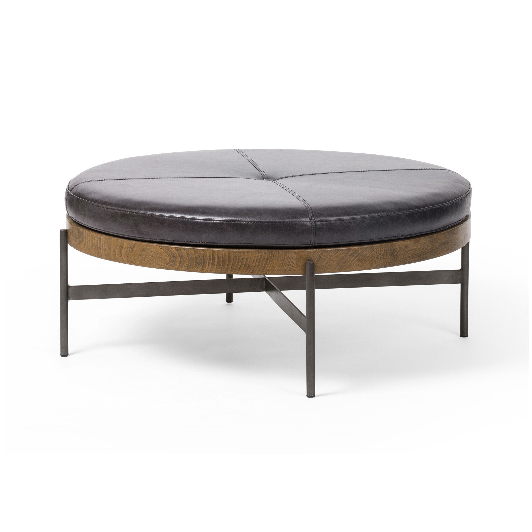 Round ottoman with leather top and metal frame on a white background