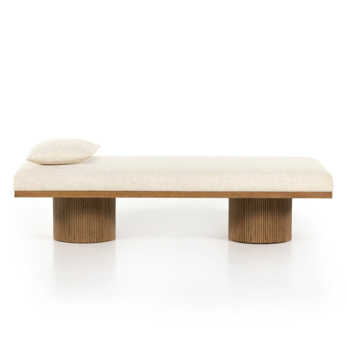 Modern bench with wooden legs and beige cushion on a white background