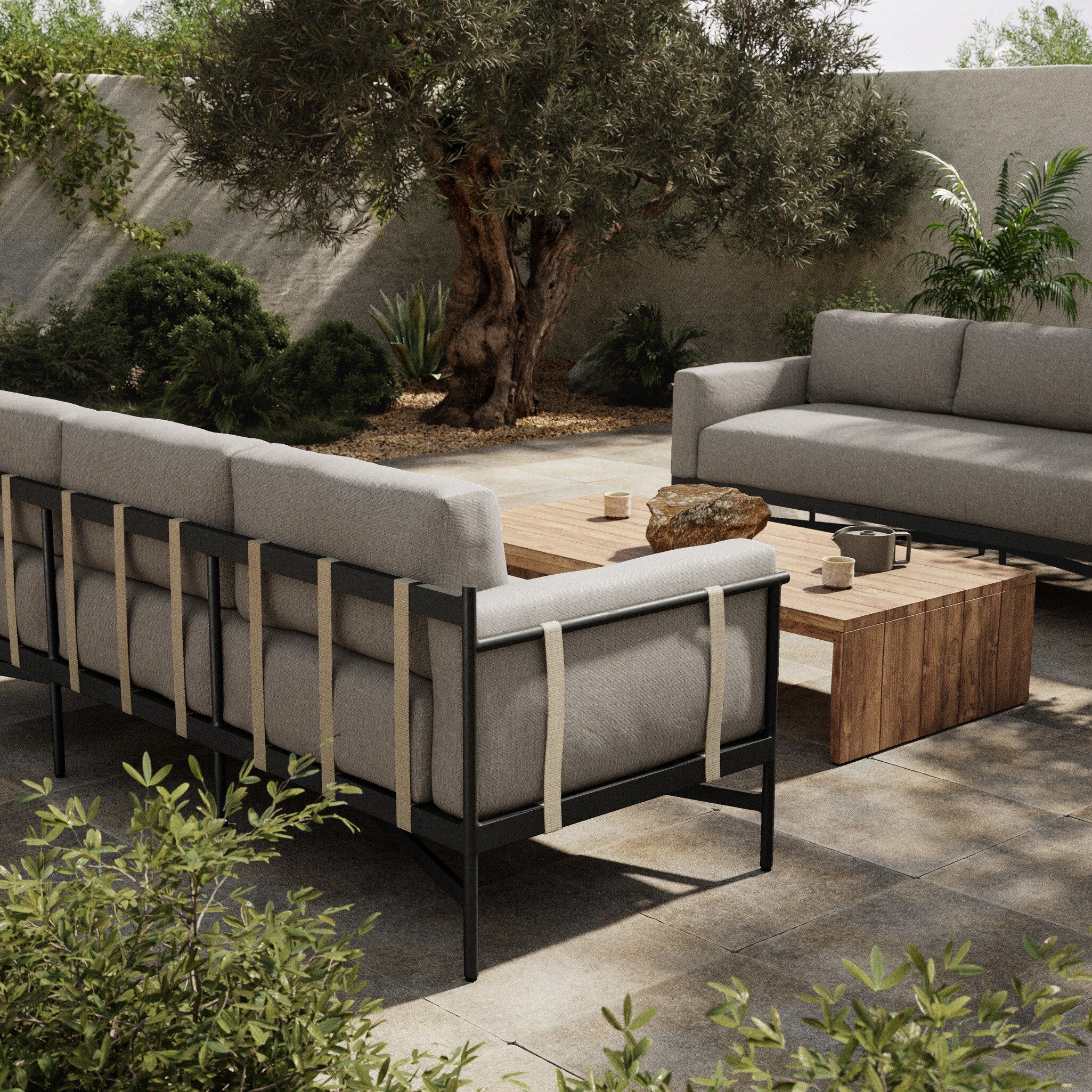 Outdoor patio setting with modern furniture and plants