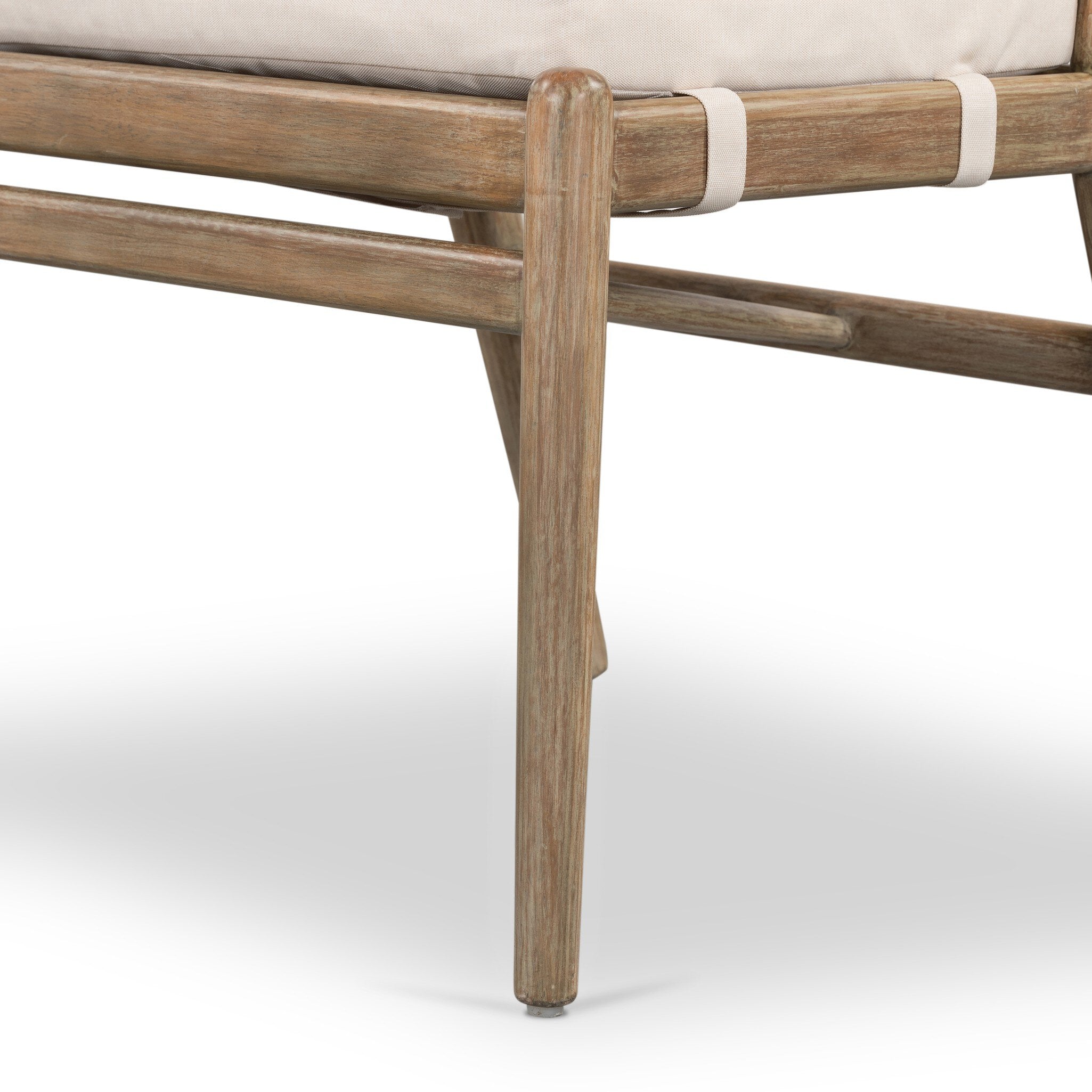 Close-up of a wooden chair with a white cushion on a white background