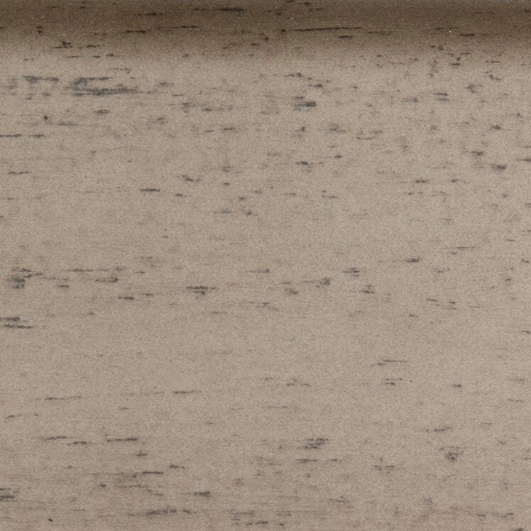 Close-up of a textured beige surface with small black specks