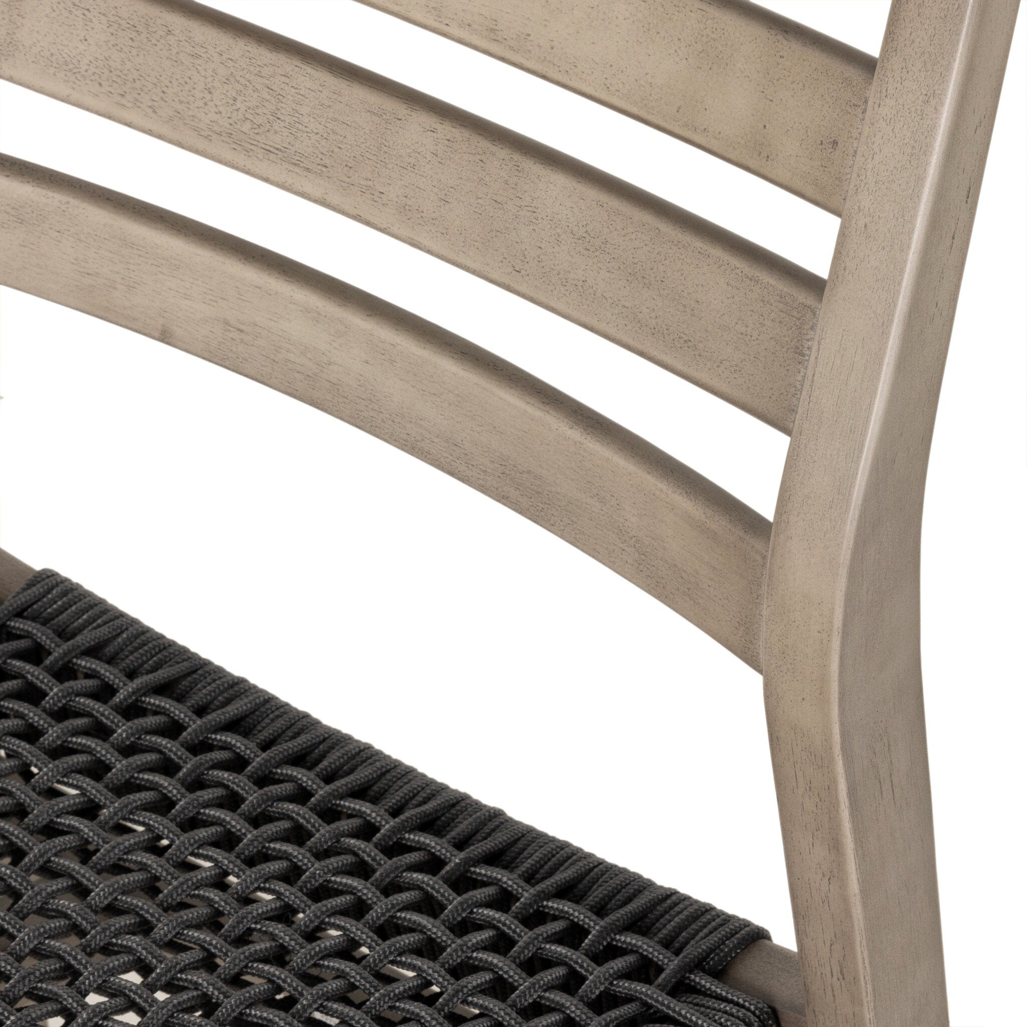 Close-up of a chair with woven seat and wooden slats on a white background