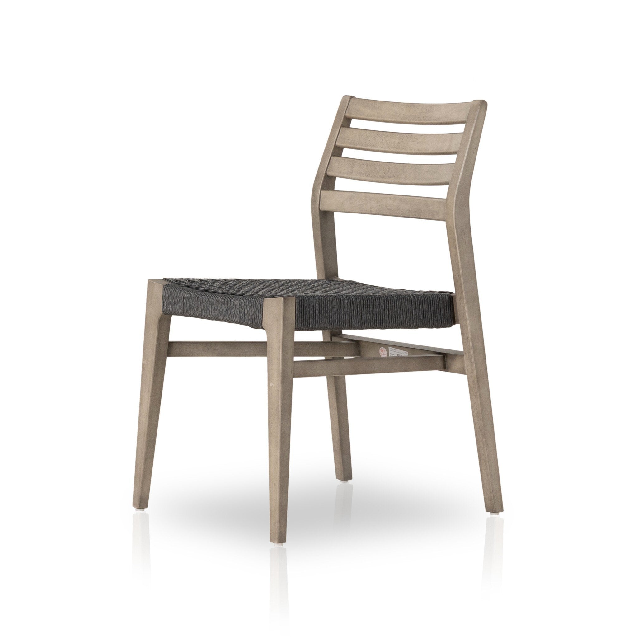 Wooden dining chair with black woven seat on a white background
